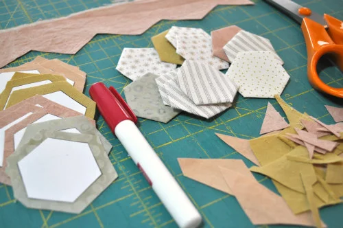 1" hexis cut from paper and wrapped with fabric. I'm a fan of glue basting.