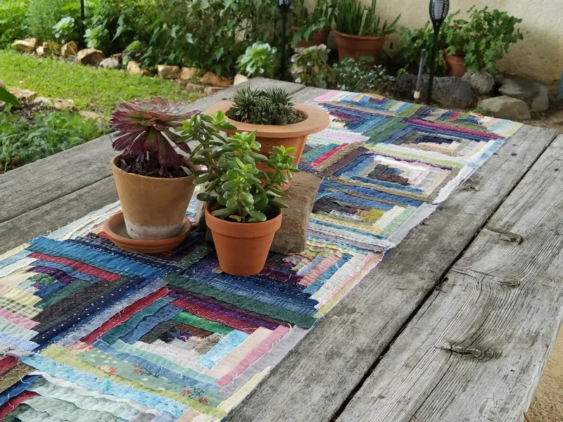 Picture perfect, Barbara’s log cabin table runner is ready for company!