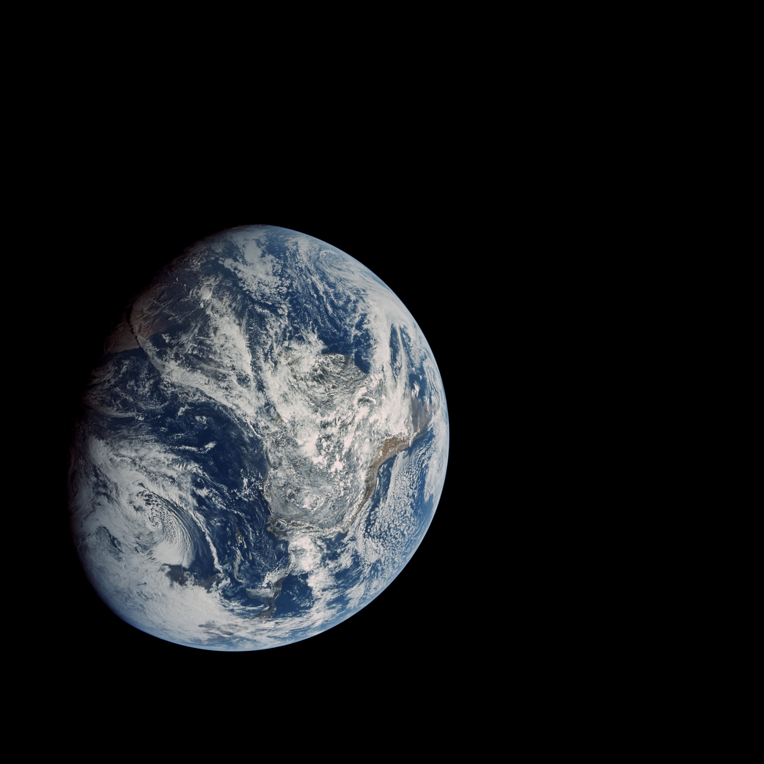  Apollo 8  The moment humans first saw the whole Earth with their own eyes.  Floating in space, the Apollo 8 crew saw the Earth at this unexpected angle, with North to the lower-left. It was taken on the way to the Moon, from a distance of 27,000 km.