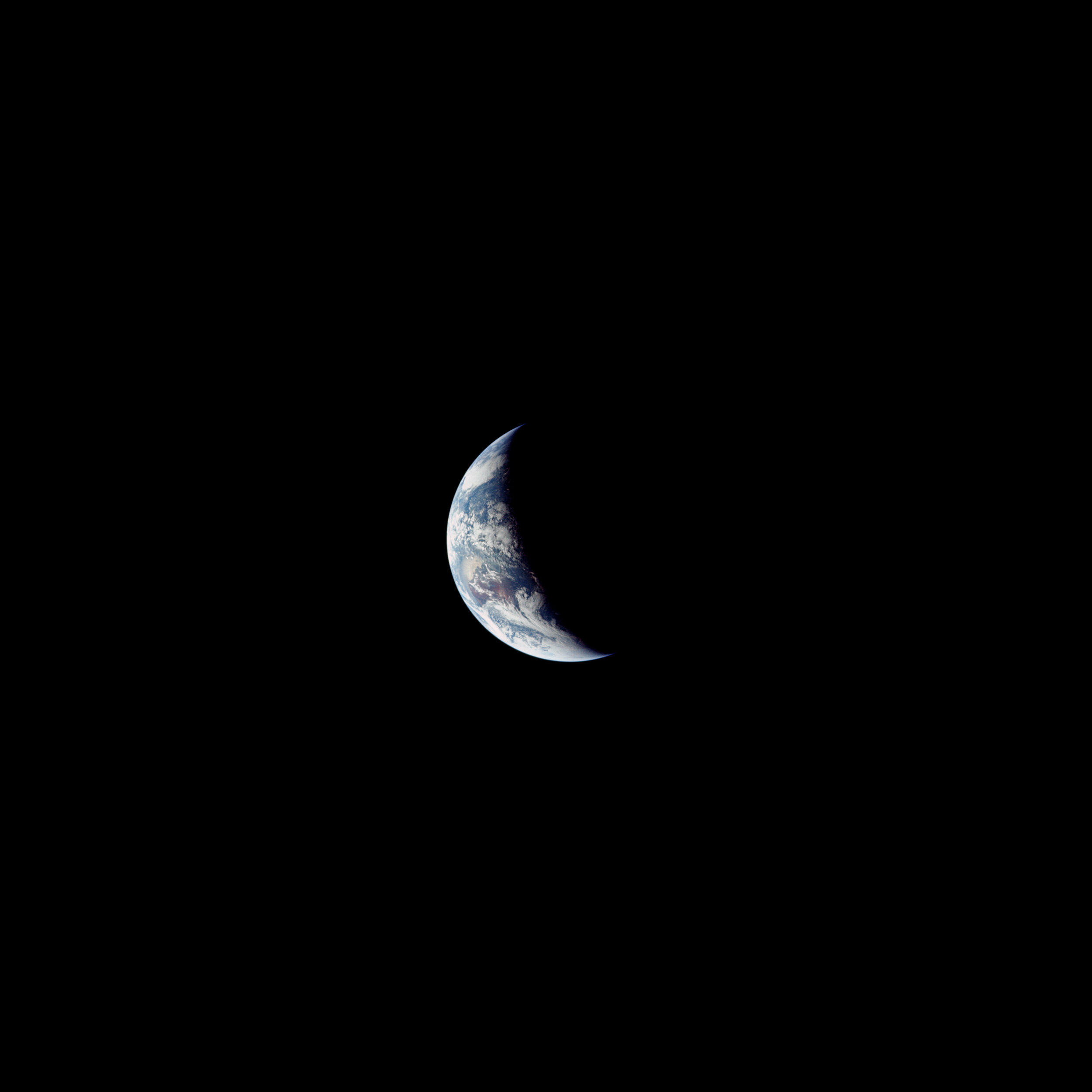  Apollo 12  At a great distance the crescent Earth takes on a striking resemblance to the Moon. Yet looking closely, we can see Australia near the centre, and part of Antarctica at the bottom, bathed in summer light. This image was taken by the Apoll