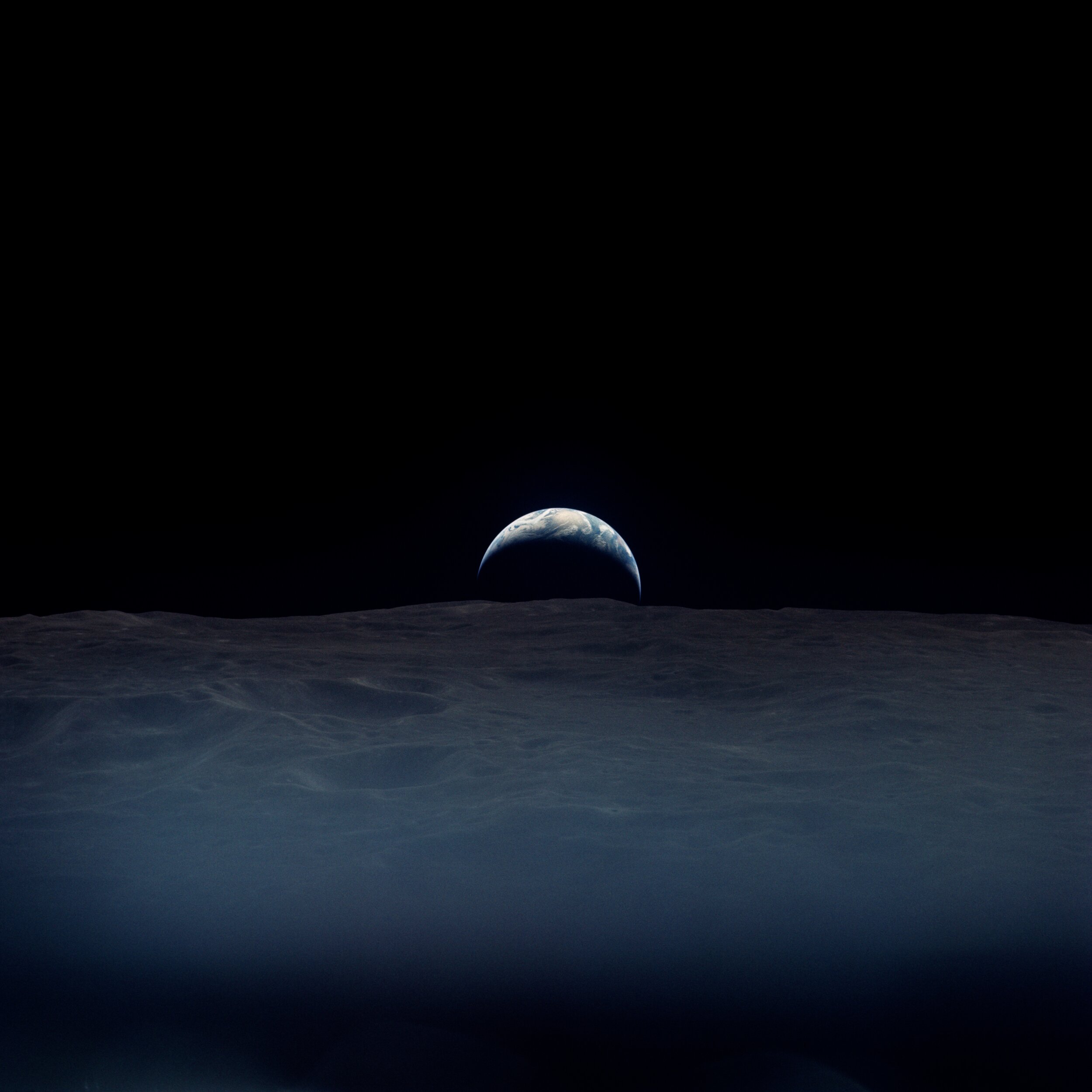  Apollo 12  A haunting crescent earthrise.  It was taken by Richard Gordon, alone aboard the Command Module while the others were down on the lunar surface. Under the clouds lies the Indian Ocean.   Full Resolution   Date – ~12:00 UTC 19 Nov 1969 Len