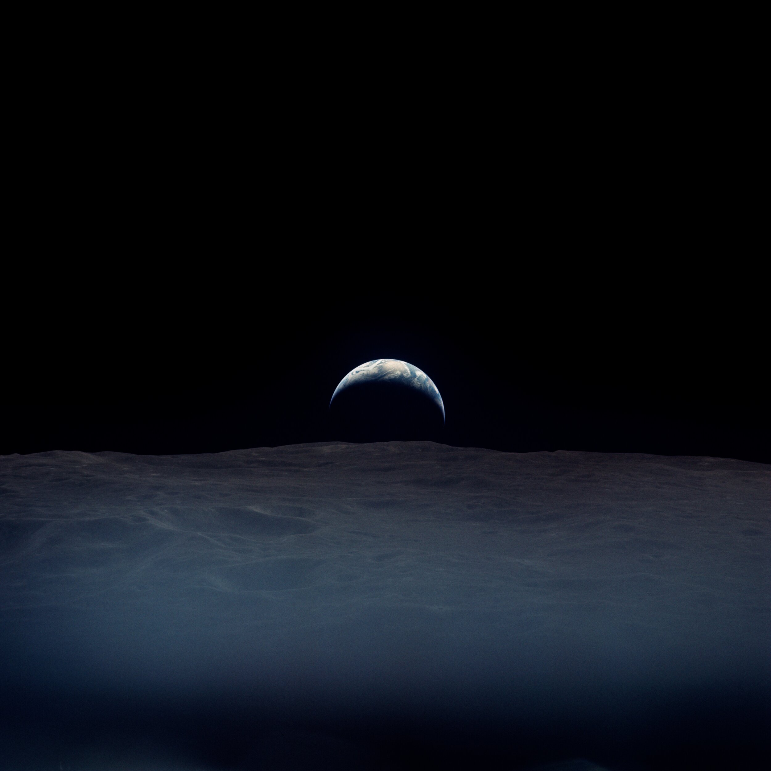  Apollo 12  A haunting crescent earthrise.  It was taken by Richard Gordon, alone aboard the Command Module while the others were down on the lunar surface. Under the clouds lies the Indian Ocean.   Full Resolution   Date – ~12:00 UTC 19 Nov 1969 Len