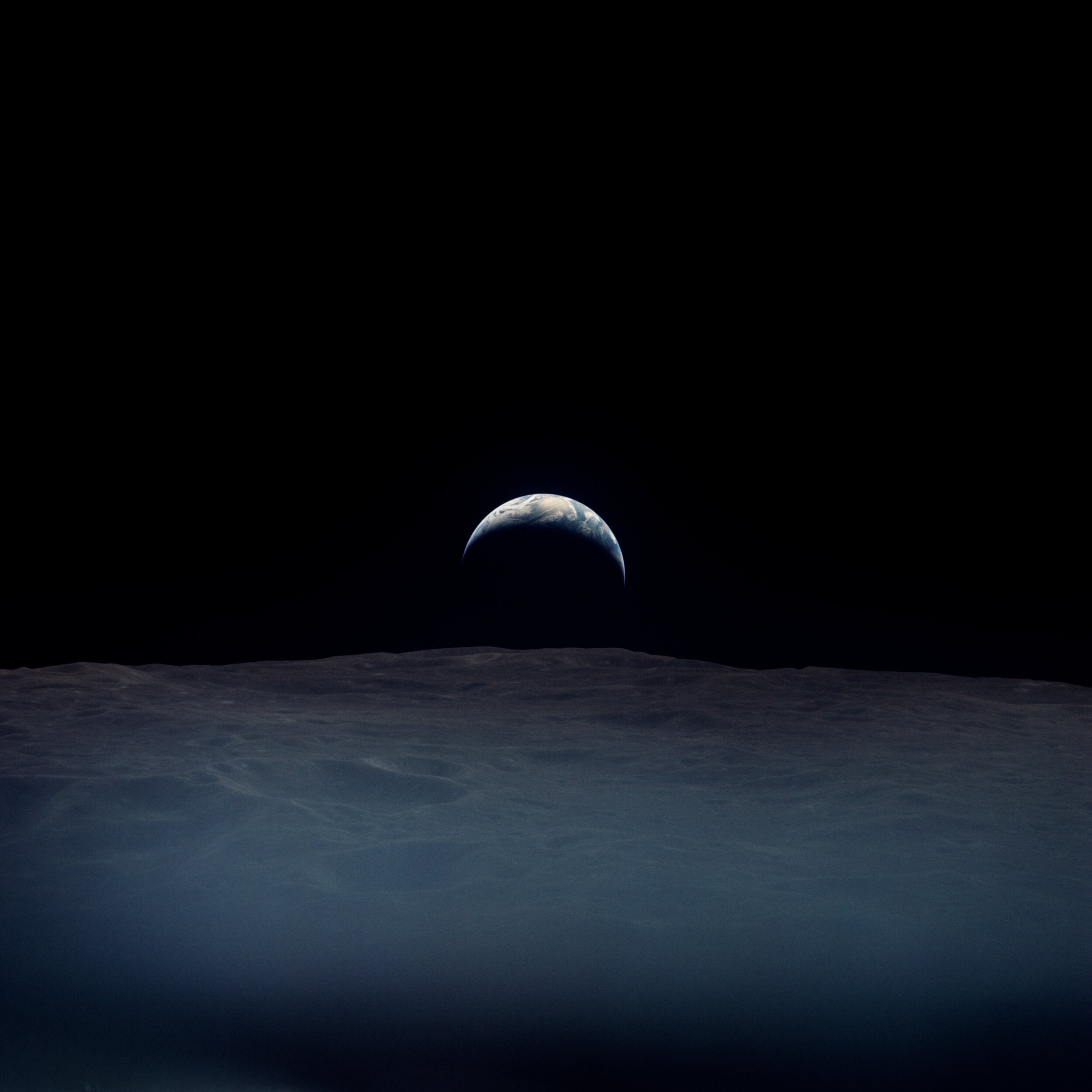  Apollo 12  A haunting crescent earthrise.  It was taken by Richard Gordon, alone aboard the Command Module while the others were down on the lunar surface. Under the clouds lies the Indian Ocean.   Full Resolution   Date – ~12:00 UTC 19 Nov 1969 Len