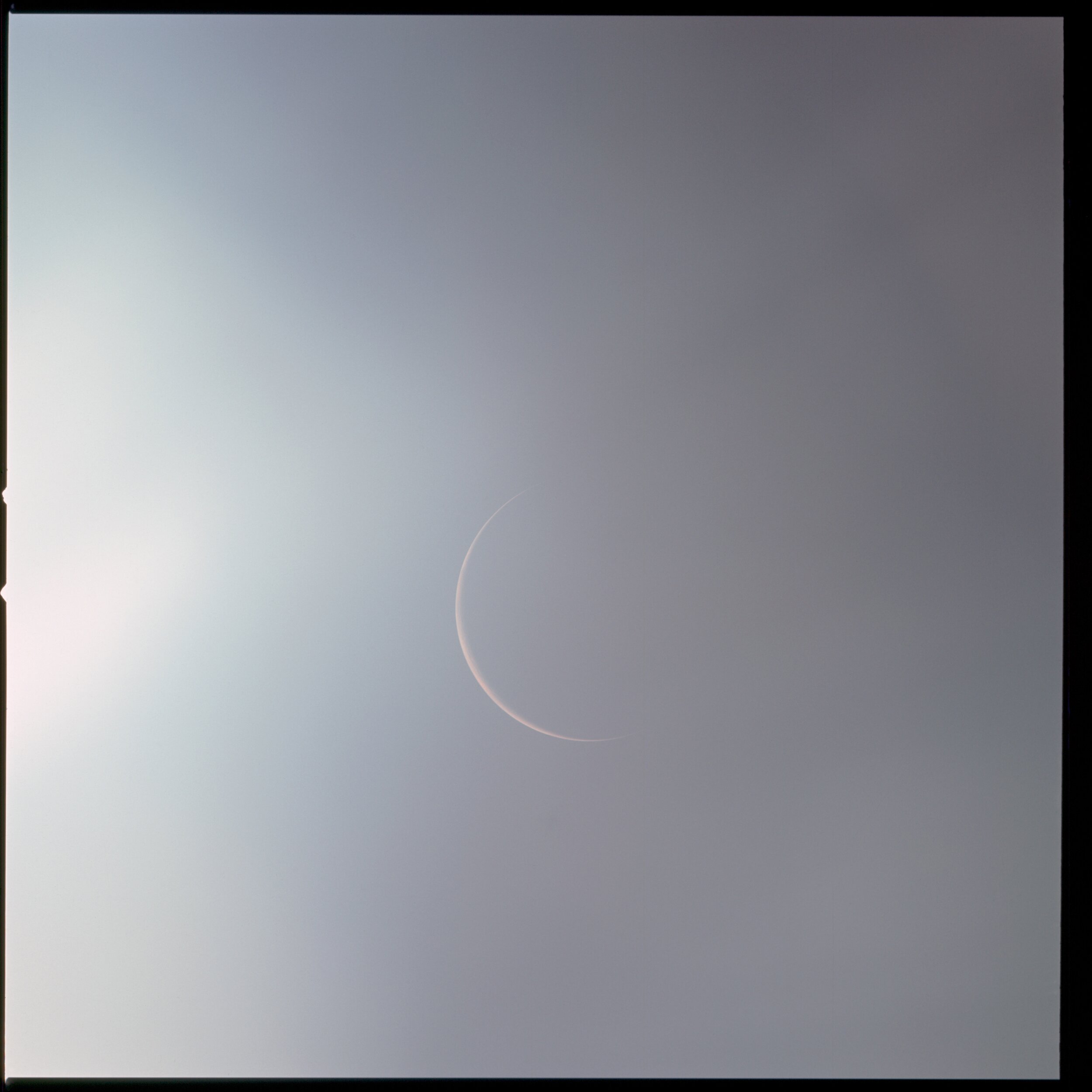  Apollo 12  A slender crescent Earth, captured by the crew of Apollo 12 on their way home. The glare of the sun from the left has washed out the image, but granted it an ethereal quality.   Full Resolution   Date – 21-22 Nov 1969 Lens – Zeiss Sonnar 