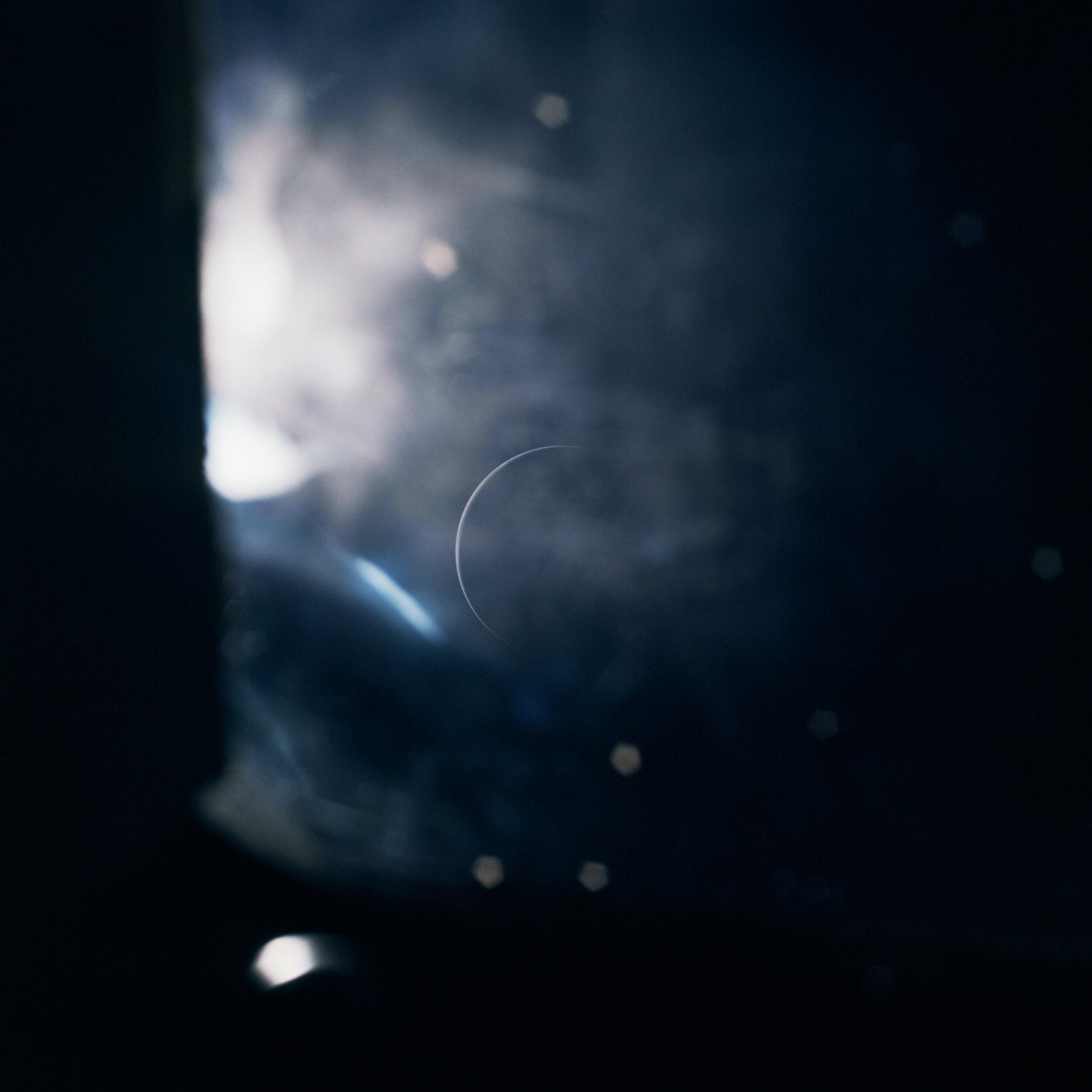  Apollo 15  A slender crescent Earth seen through the grime and reflections of a Command Module window. Taken by the crew of Apollo 15 on their journey home.   Full Resolution   Date – 7 August 1971 Lens – Zeiss UV Sonnar ƒ-4.3/105mm Code – AS15-96-1