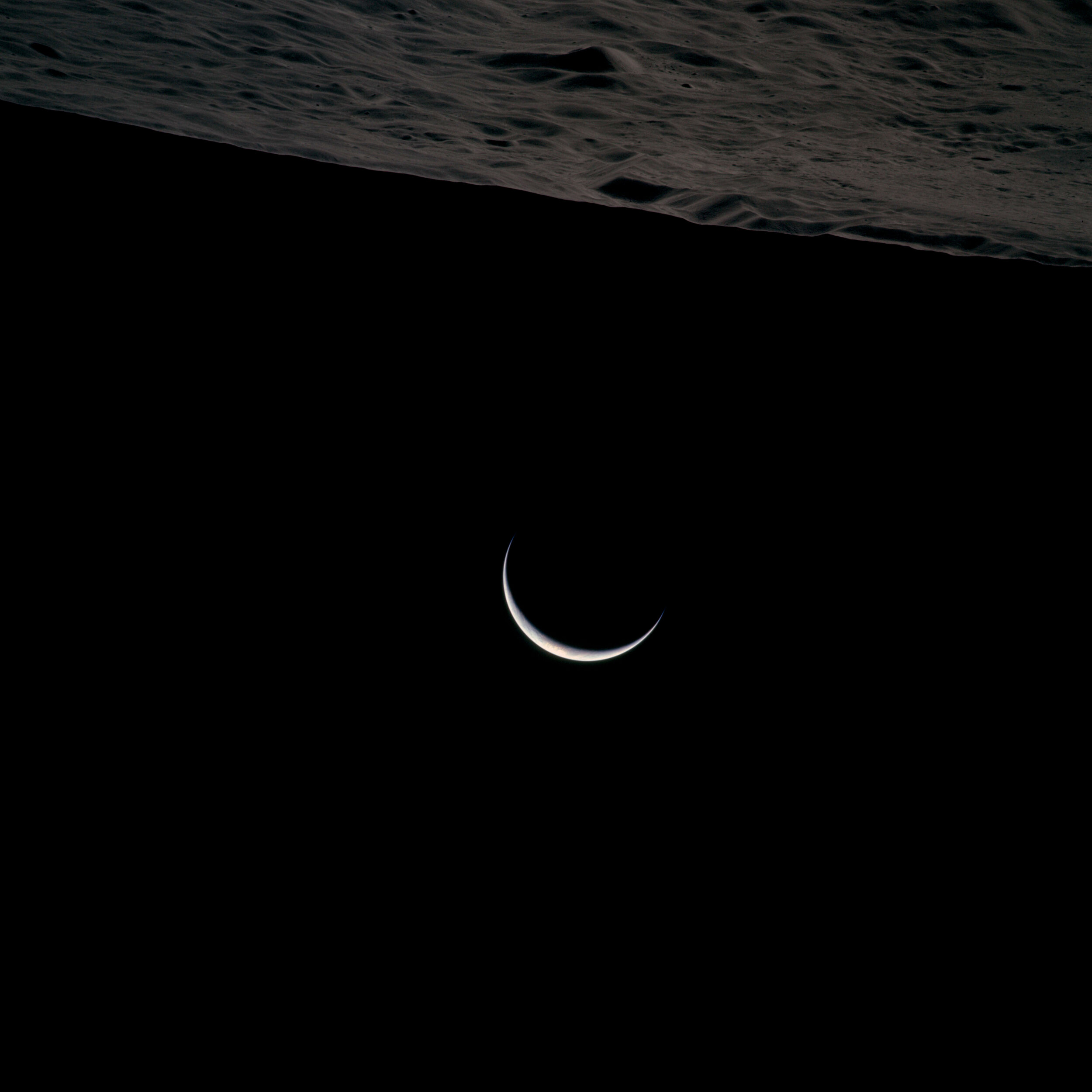  Apollo 15  Earthrise from Apollo 15. It is not immediately obvious, but this photograph is in colour. It was taken in this unusual orientation, with the lunar surface at the top and a thin crescent Earth hanging below. North is to the upper left.  A