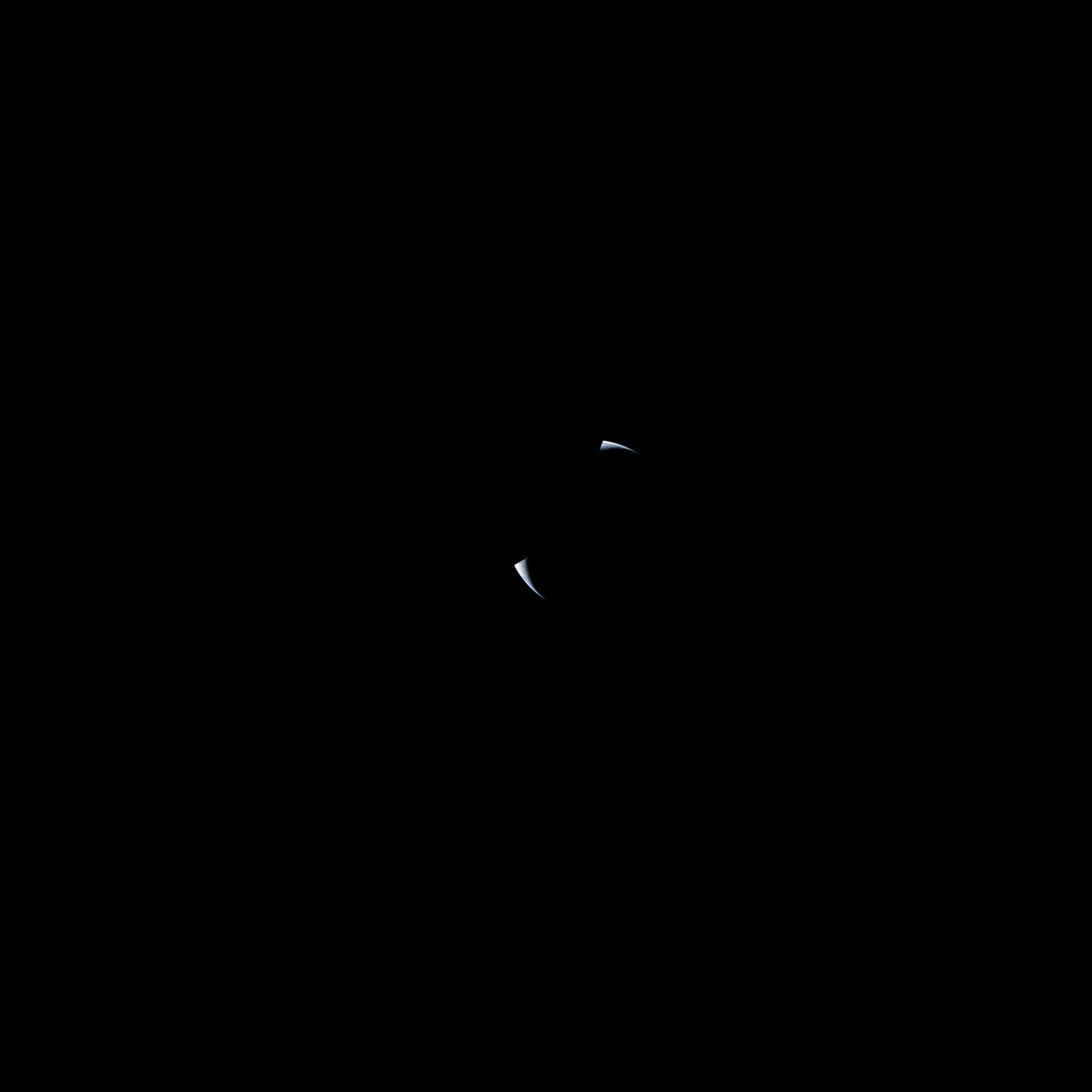  Apollo 17  A rare sequence capturing an earthset. The Earth disappears behind an unlit lunar horizon—consumed in the darkness.   Full Resolution   Date – ~15:25 UTC, 16 December 1972 Lens – Zeiss Sonnar ƒ-5.6/250mm Code – AS17-152-23281 Scan – LPI (