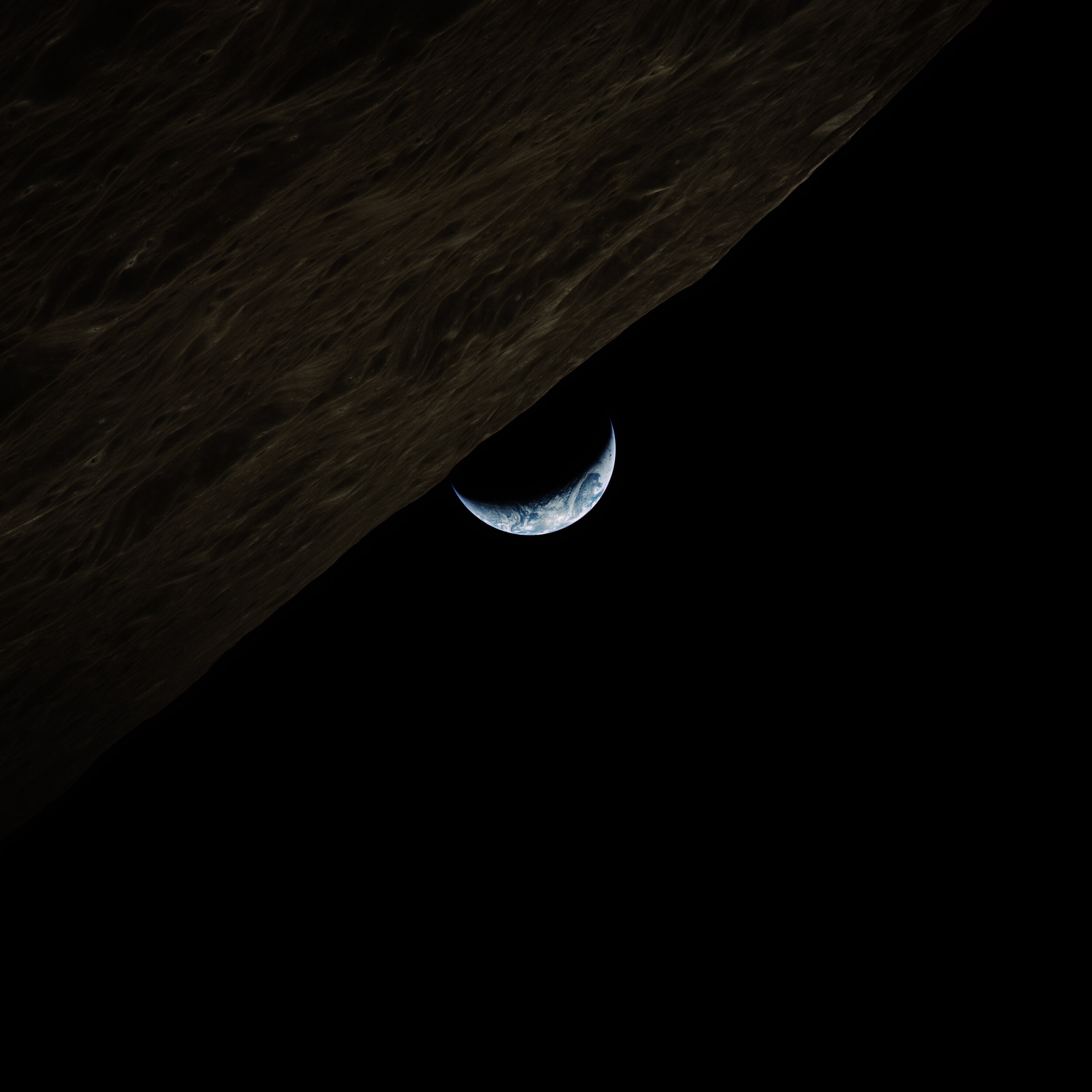  Apollo 17  A surreal crescent earthrise. Taken by the crew of Apollo 17, a day after they had reunited in lunar orbit. They would have no idea that it would be more than fifty years before someone else will again touch the Moon.   Full Resolution   