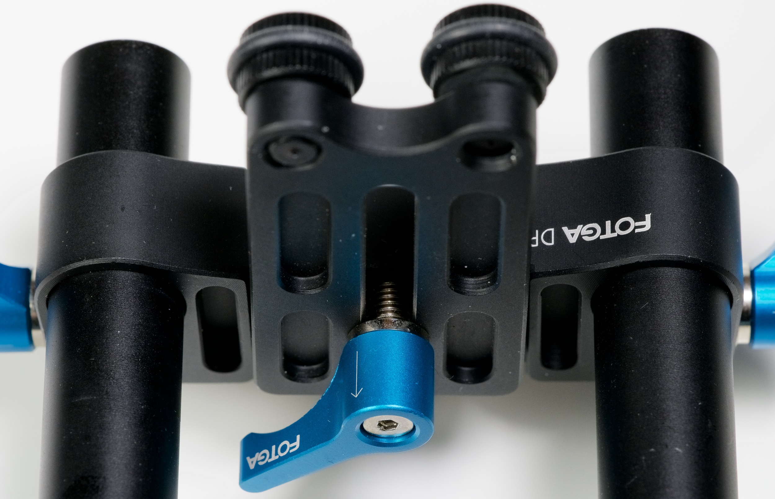 The fact that the FOTGA uses a separate set of clamps for the rod attached only to the rods -- as opposed to part of the baseplate itself -- contributes to its limited utility for all but the lightest cameras. Which is fine, if you're using a light camera. But having the locking lever mounted between the rails is sub-optimal. Which is also fine if money is tight.