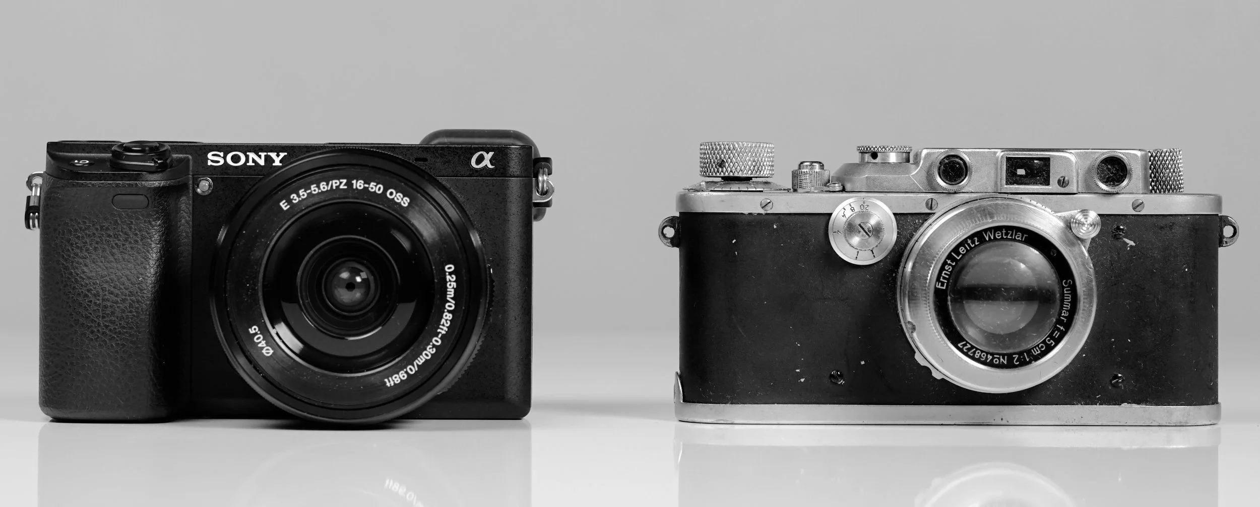 That's my mother's Leica IIIa on the right, bought second-hand from Bauhaus trained photographer Hilde Hubbuch, similar to the one used by Henri Cartier-Bresson.  This is the camera that introduced me to photography. On the left, my Sony a…