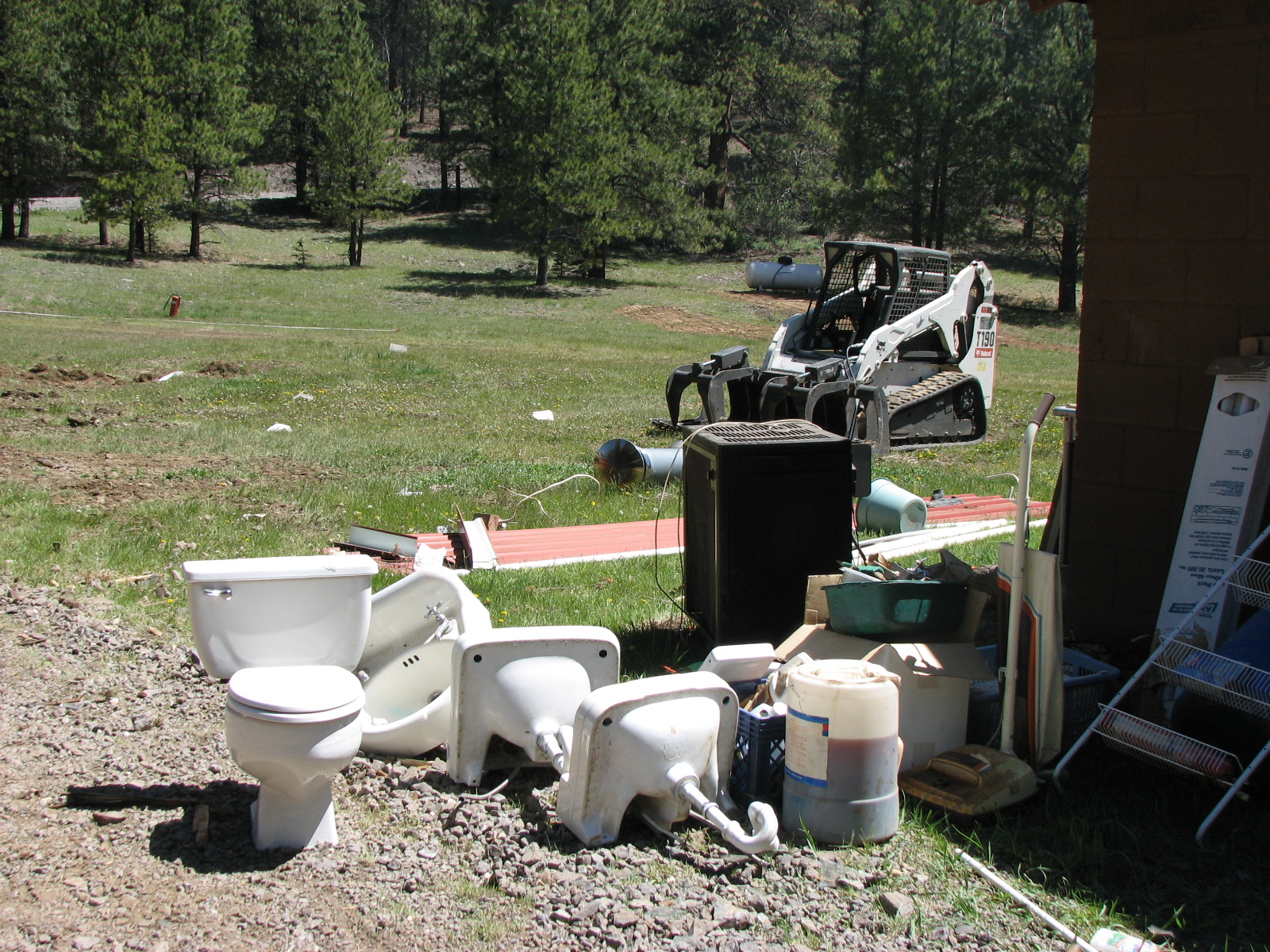 Out with the old, broken toilets & sinks