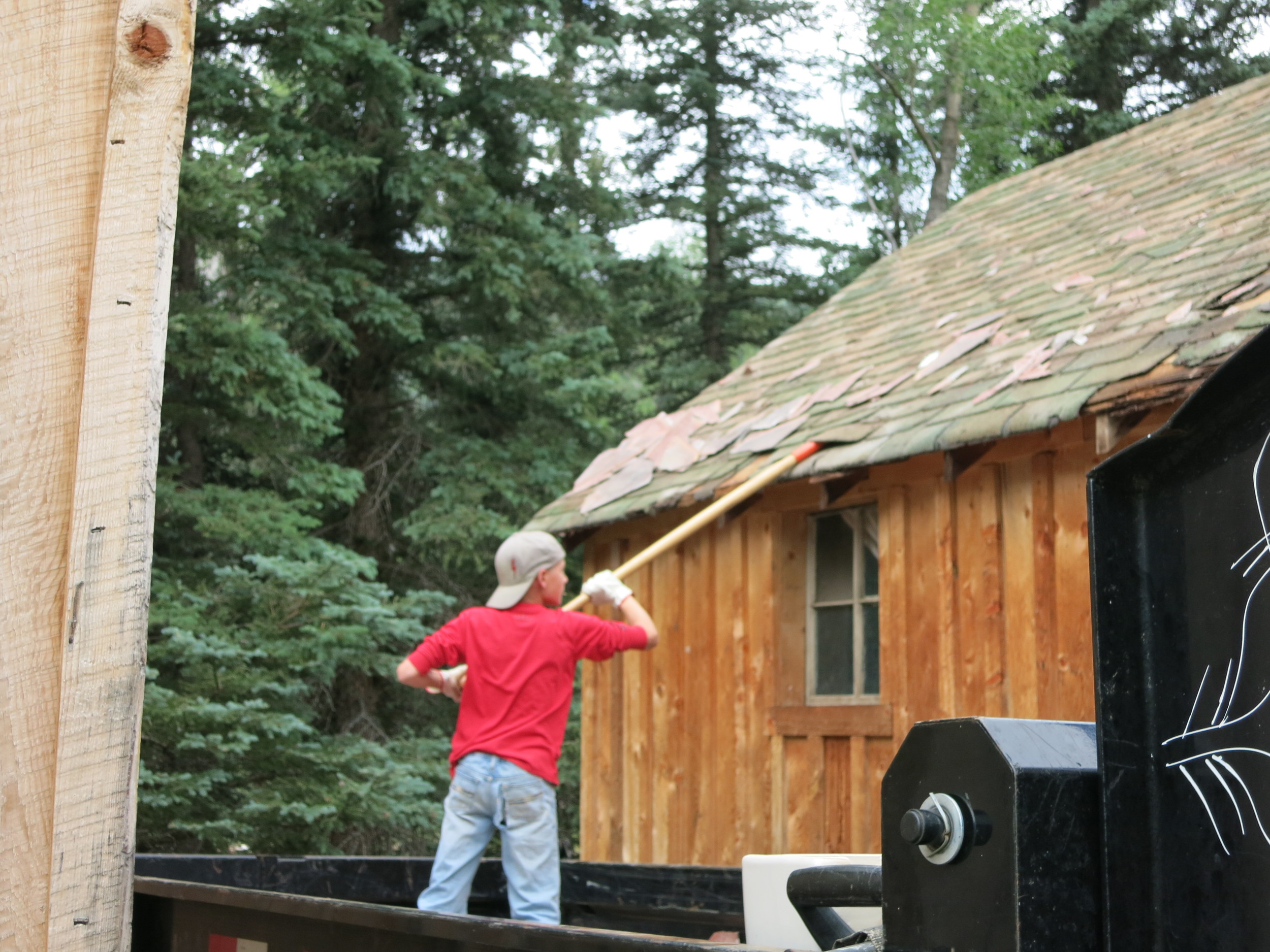 Removing the old roof from cabins