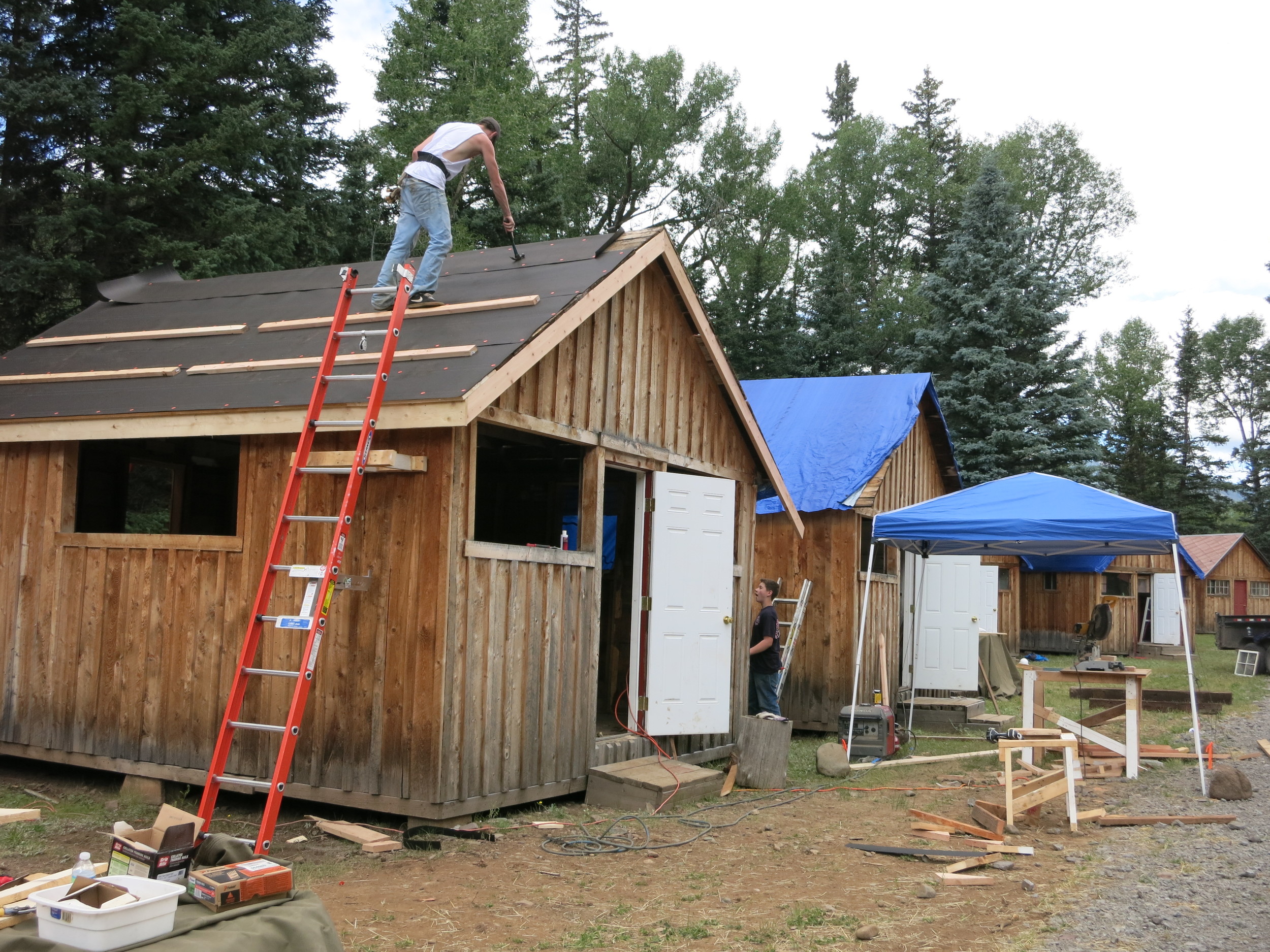 Installing new roof on cabins