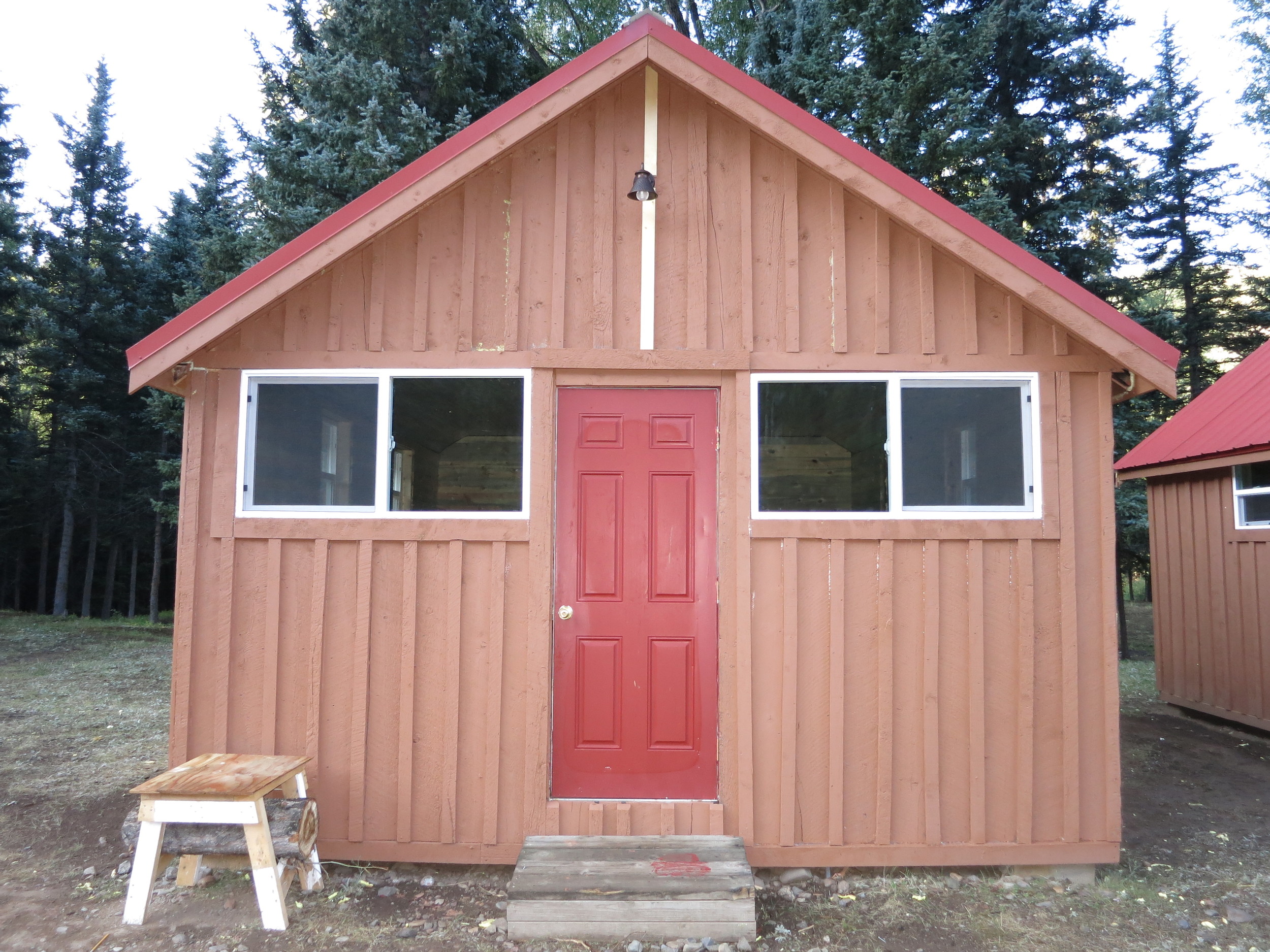 A cabin after a new roof, new windows & paint