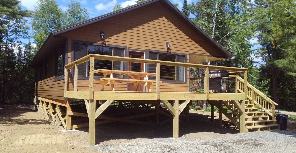 Cabin 27, built in 2019, nestled among the trees with a large deck