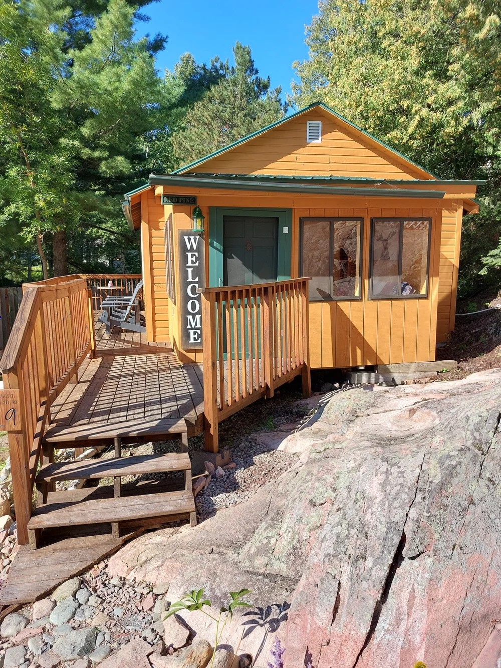 Cabin 19 with its wrap-around deck near the water's edge