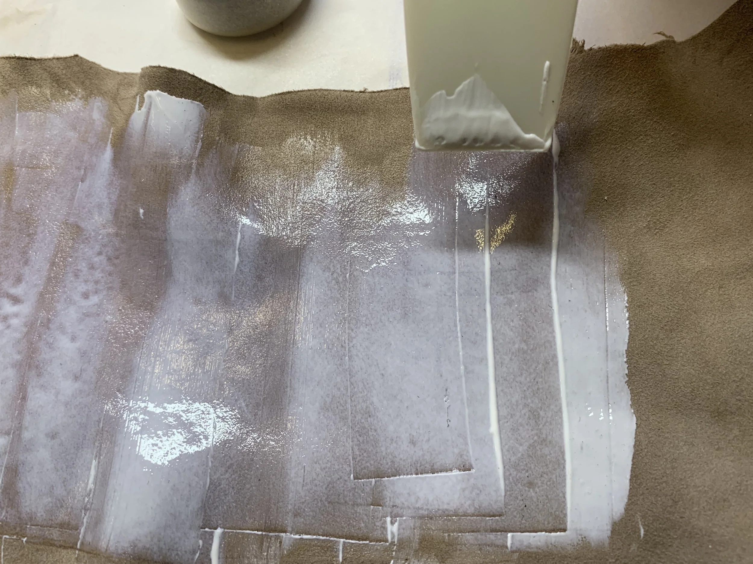 Applying the glue to the suede