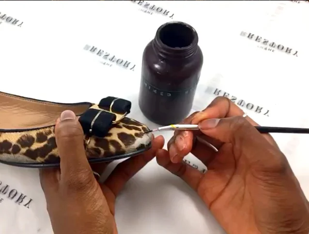 Hand painting the leopard print pattern