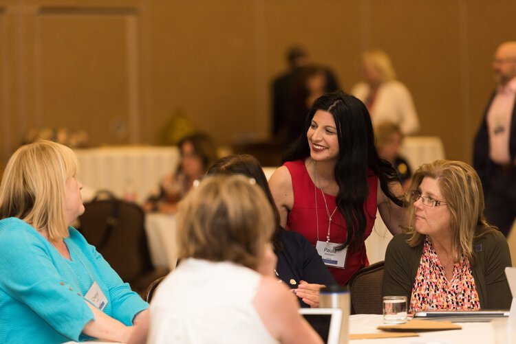 Paula+Smile+Talking+to+Table.jpg