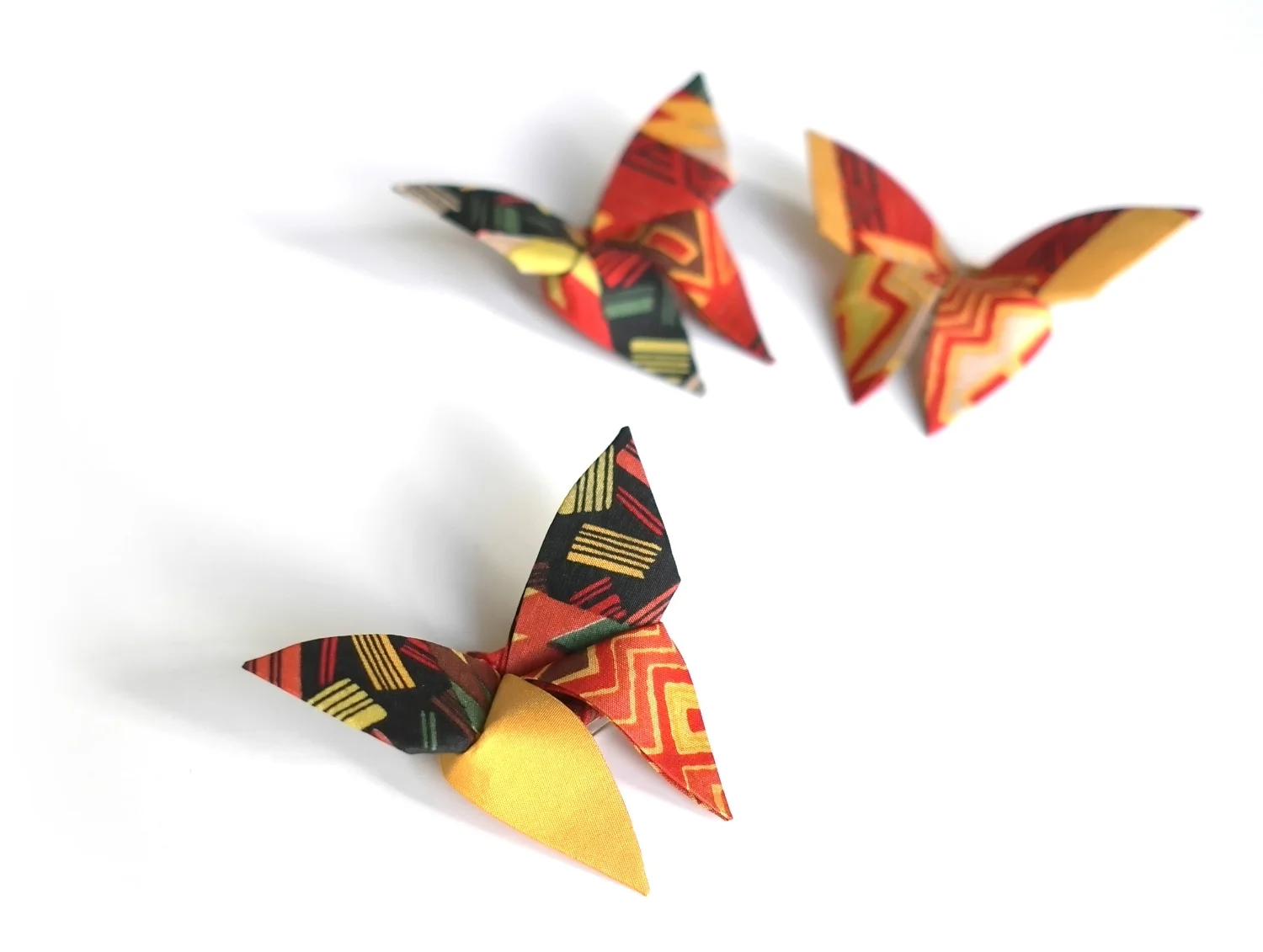 A beautiful, bright and very cherished silk scarf is transformed into Butterties. They all flew off into opposite directions, (America Singapore and Paris) to become personal gifts for a dear friends and family