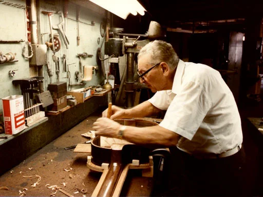 Mario Maccaferri in the late 80's at work on his D-Shape Guitar. The same guitar on display at the Metropolitan Museum of Art in 2011(below)