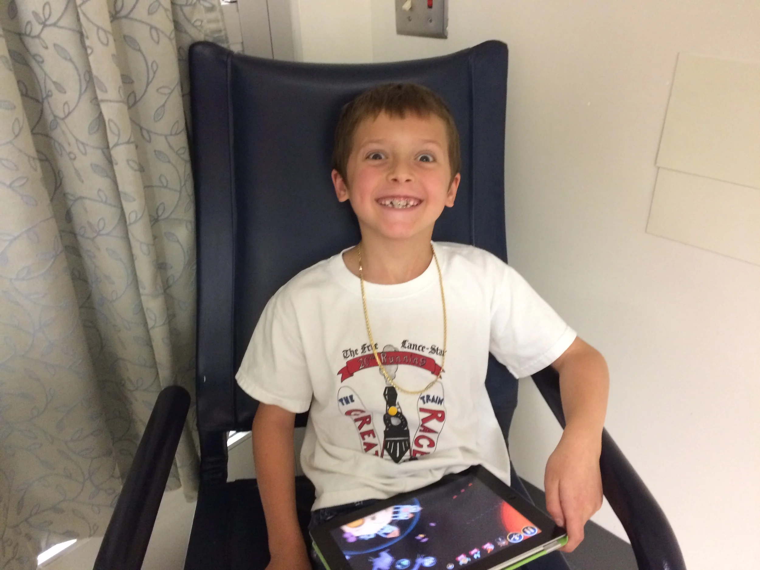 My trouper, who deserves lots of credit. He sat at the hospital for over seven hours, in that chair. There was barely a peep out of him. The only time he got up was to comfort me, when I sobbed, several times, about missing out on Comic Con, and to apologize, guiltily about how sorry I was for ruining yet another family event. My boy is the best boy in the world...even if he does take crazy pictures!