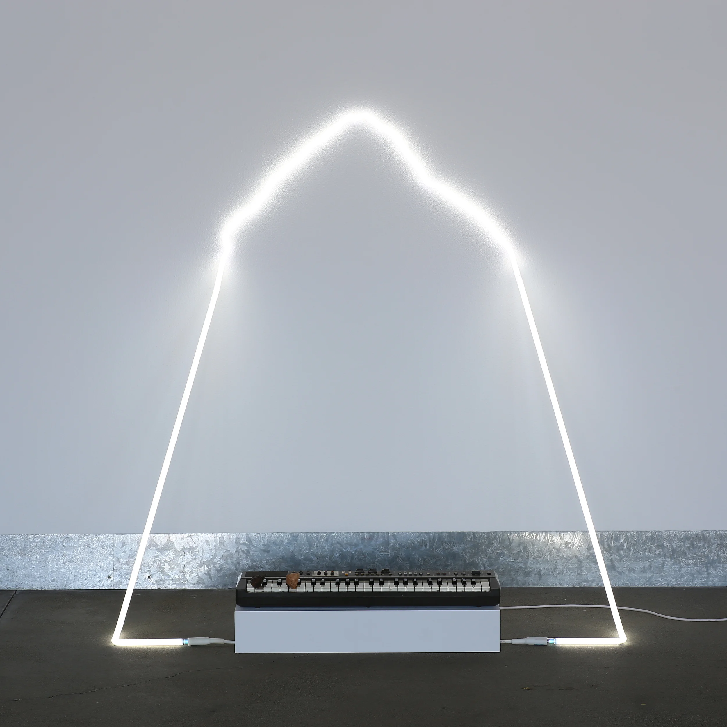 in defiance of being #7, 2014 neon, Casiotone MT-68 keyboard, rocks, dimensions variable