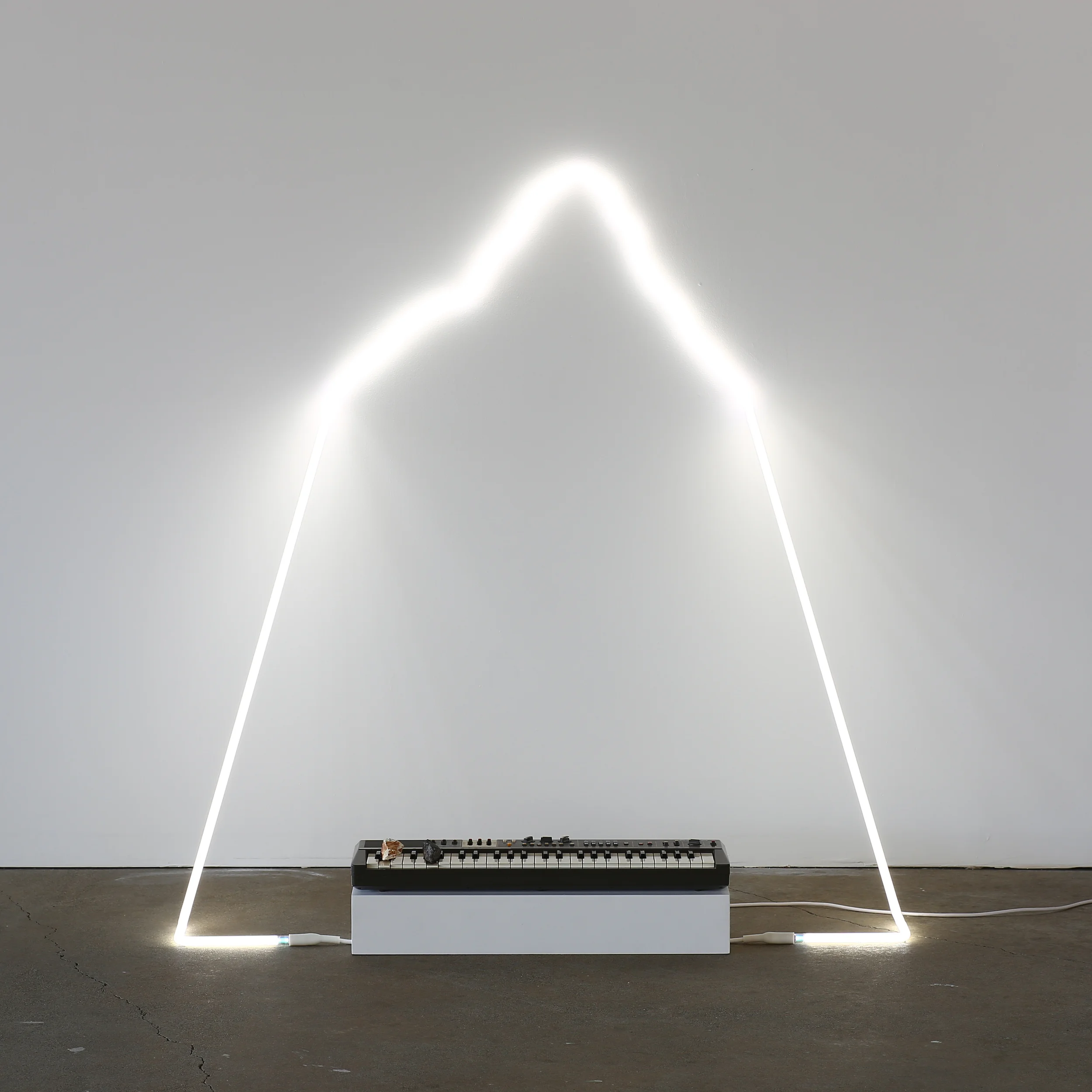 in defiance of being #6, 2014 neon, Casiotone MT-68 keyboard, rocks, dimensions variable