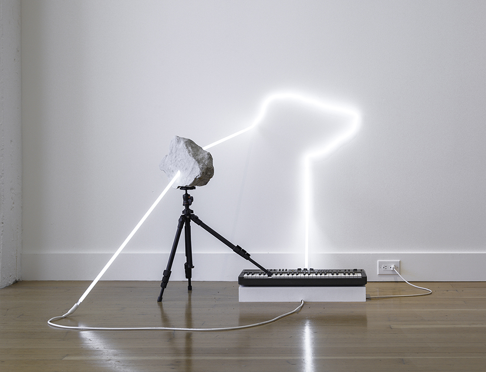 in defiance of being here #9, 2016 neon, tripod, Casiotone MT-69 keyboard, rocks, dimensions variable