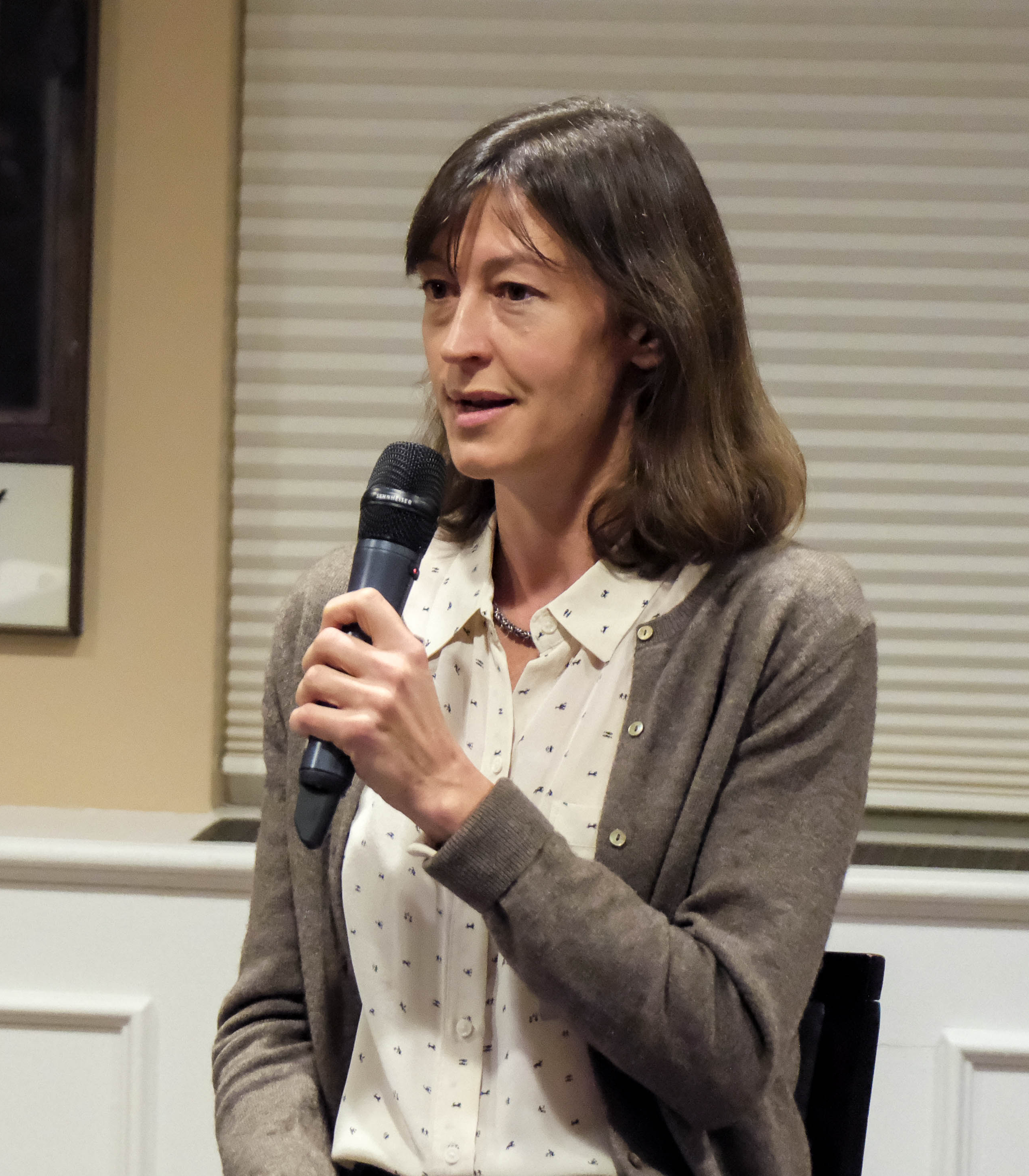 Woman holding a microphone