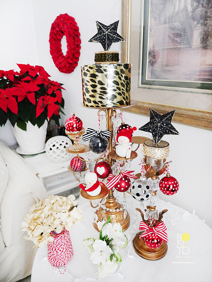  A New York City Gal has to be creative at times with space. I converted this Candle Holder Chandelier to a "Christmas Tree." Combining Classic Red for the Holidays with Black and Gold colors.