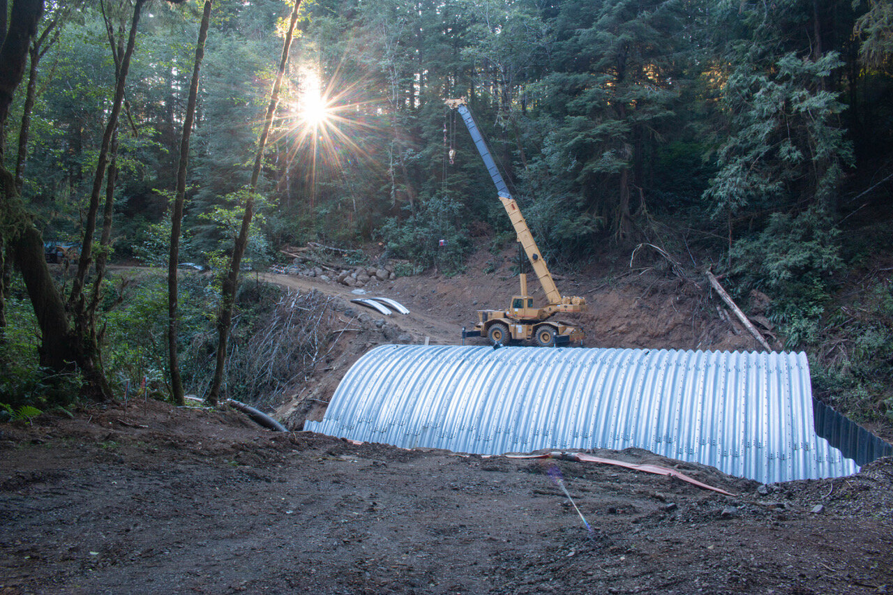 Installation of the last few segments of the new culvert.