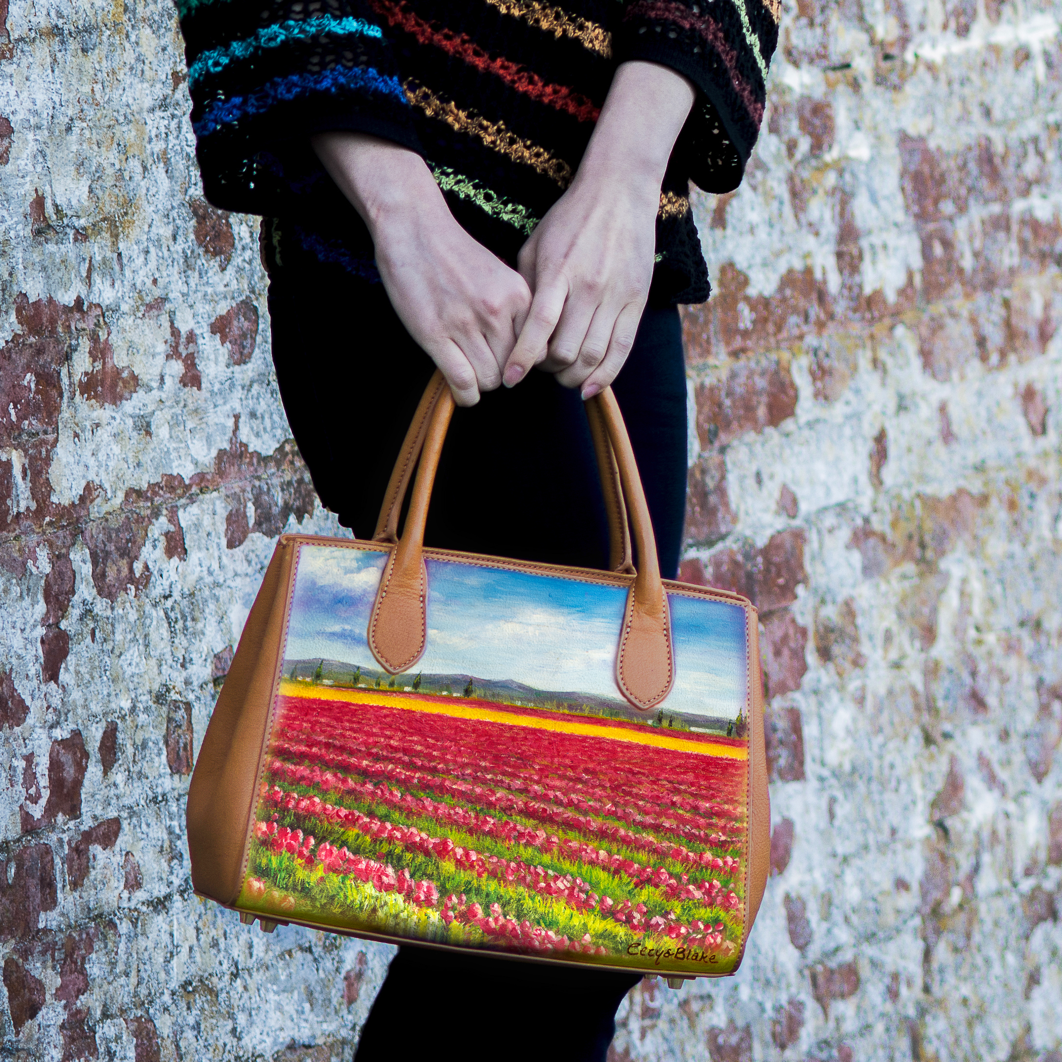 Satchel Dimensions:12”L x 8.5”H x 5”D (30.5cm x 21.5cm x 12.7cm); Tote handles with 5” (12.7cm) drop; Adjustable detachable shoulder strap with 18’’ (45.7cm) drop