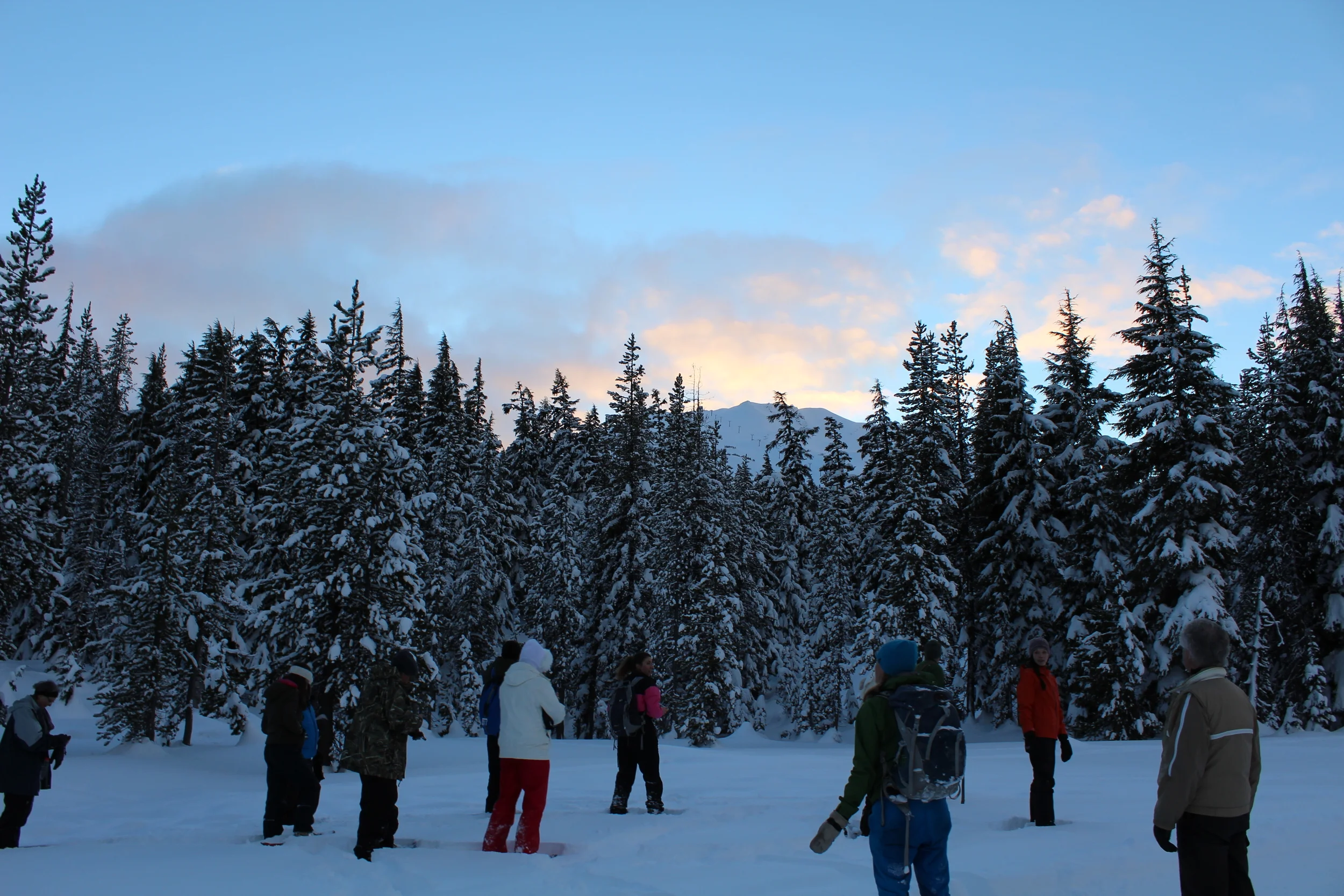 Everyone paused to take in the quiet of the forest and the beauty of the sunset at Mt. Bachelor.