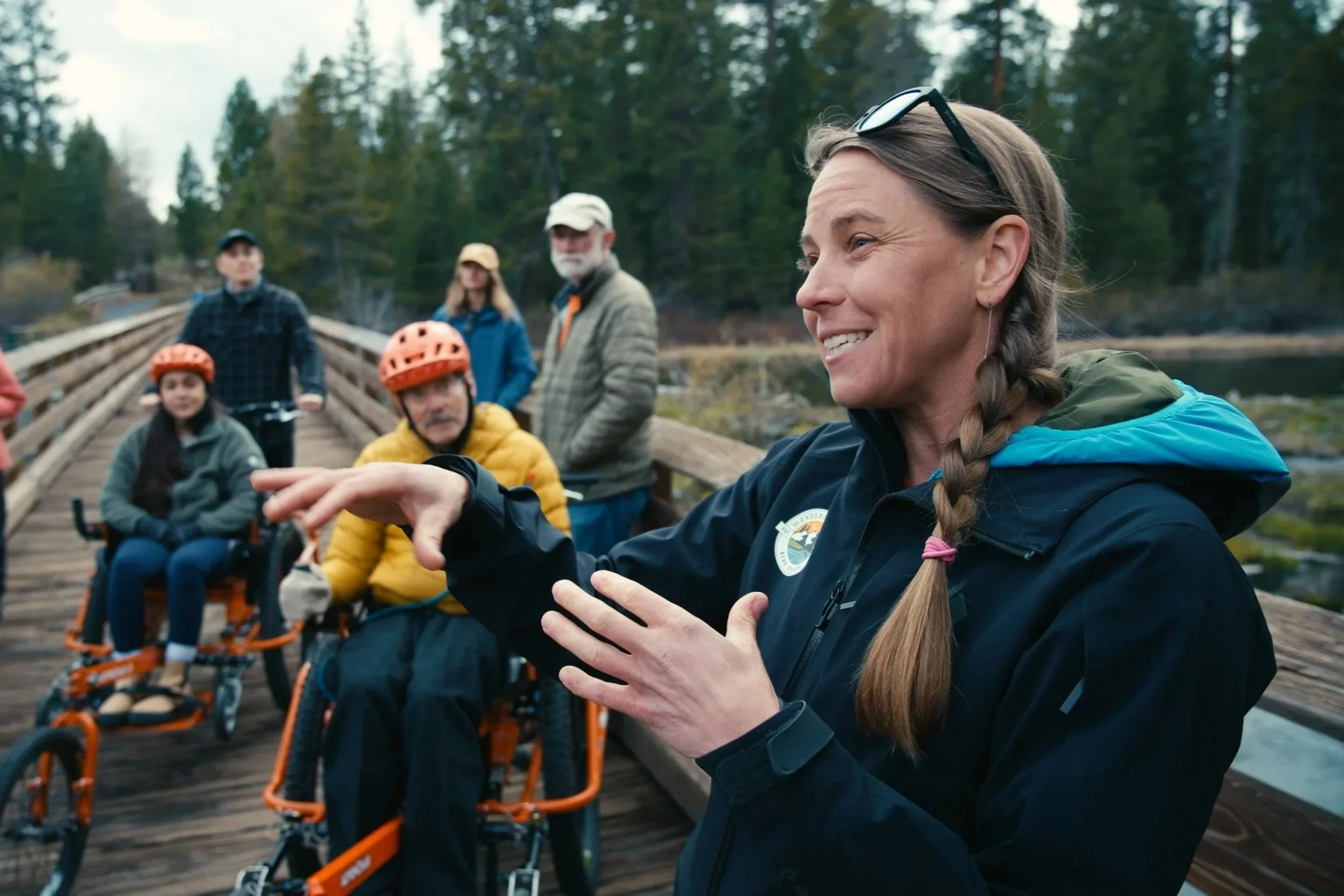 Wanderlust Tour's guide smiling and sharing the history of Benham Falls & the Deschutes River during the accessible hike