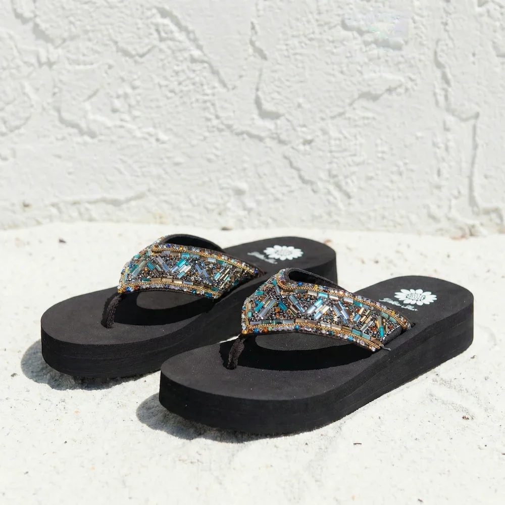 Black flip-flops with beaded straps featuring blue, gold, and silver embellishments.