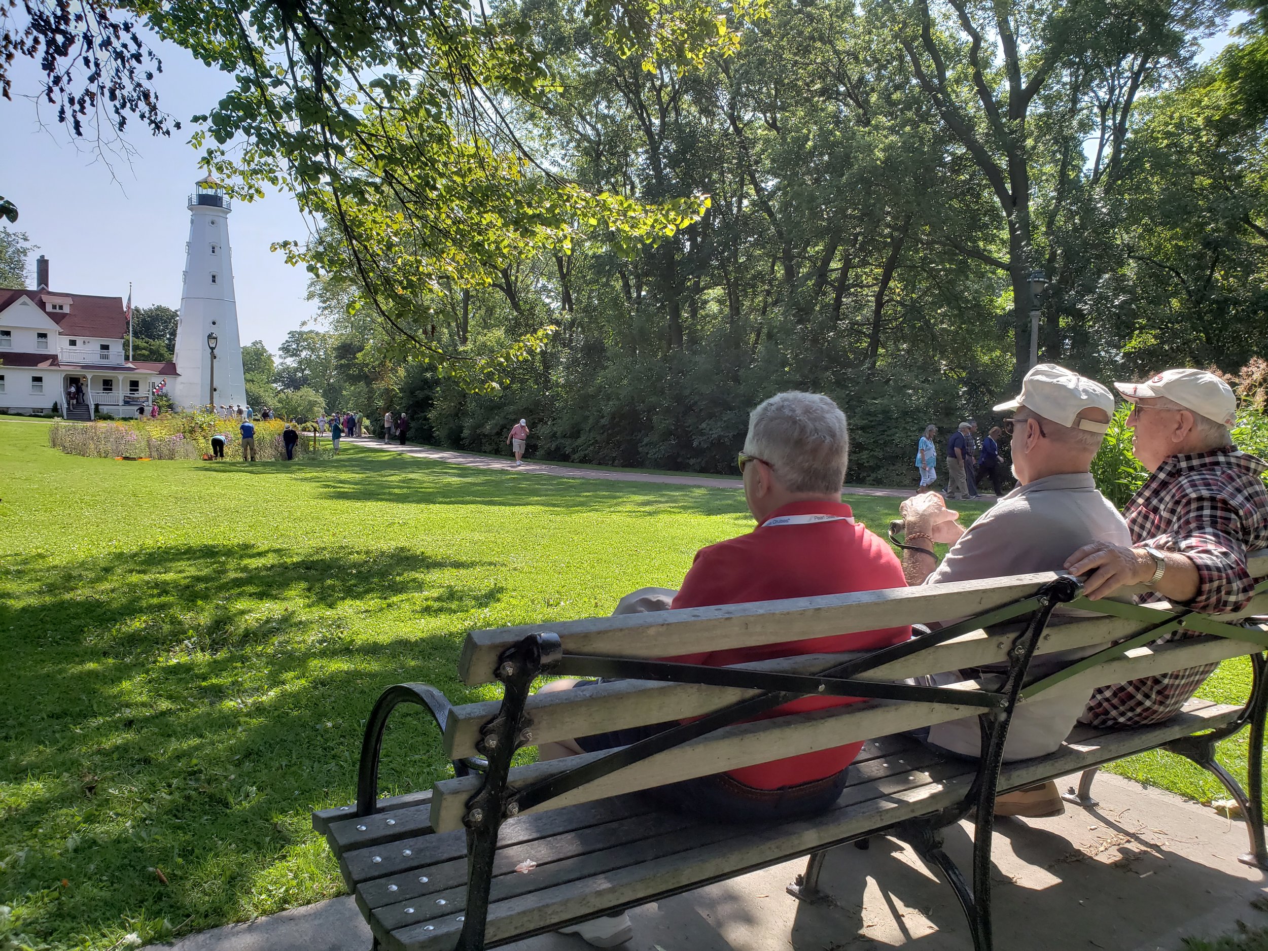 Passengers sit back to enjoy an overlook at the North Point Lighthouse while touring town with Milwaukee Food & City Tours.