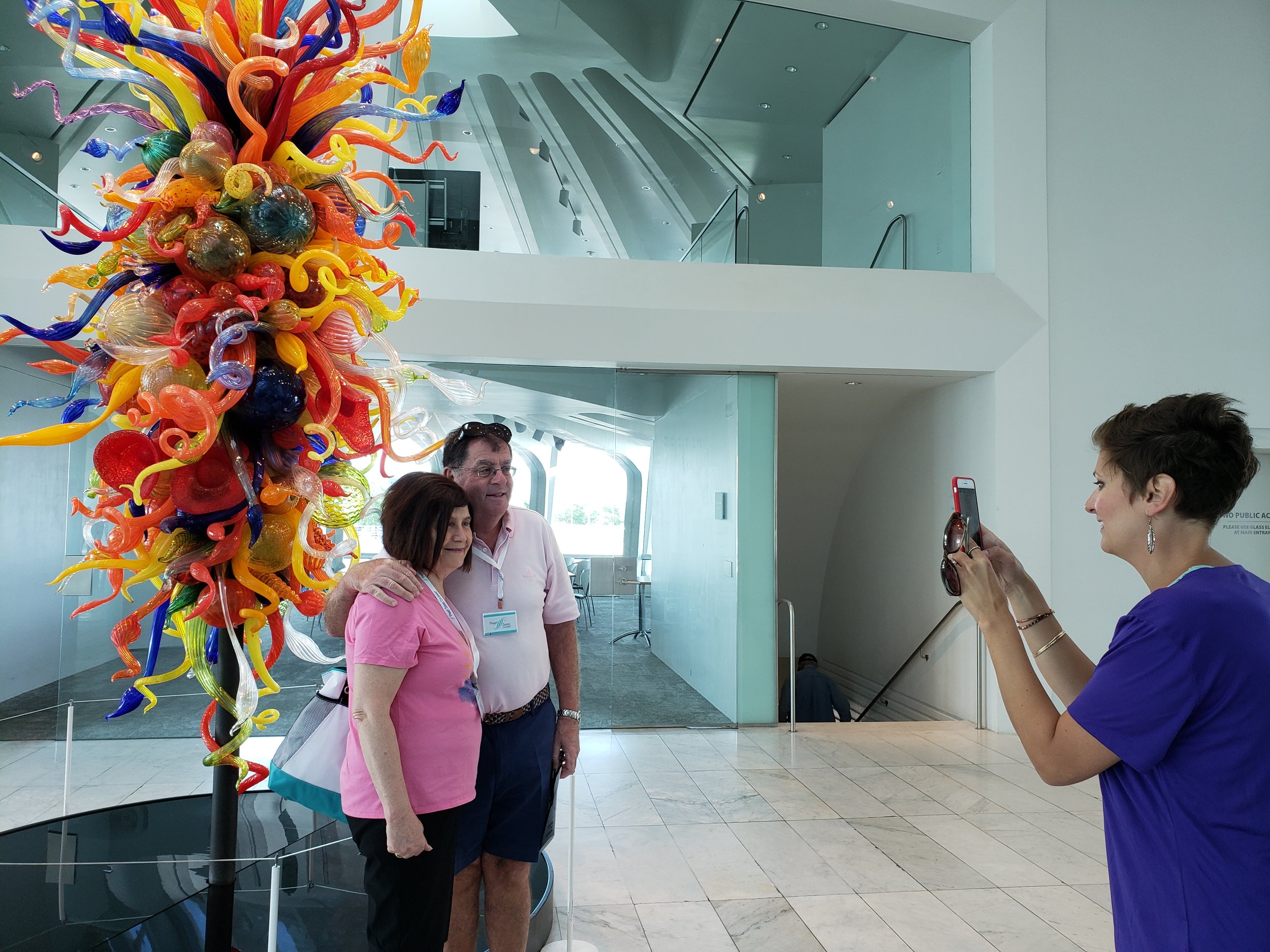  Say, “CHEESE!” Cruise ship visitors from South Africa take advantage of a photo opps offered at the Milwaukee Art Museum while visiting Milwaukee. 