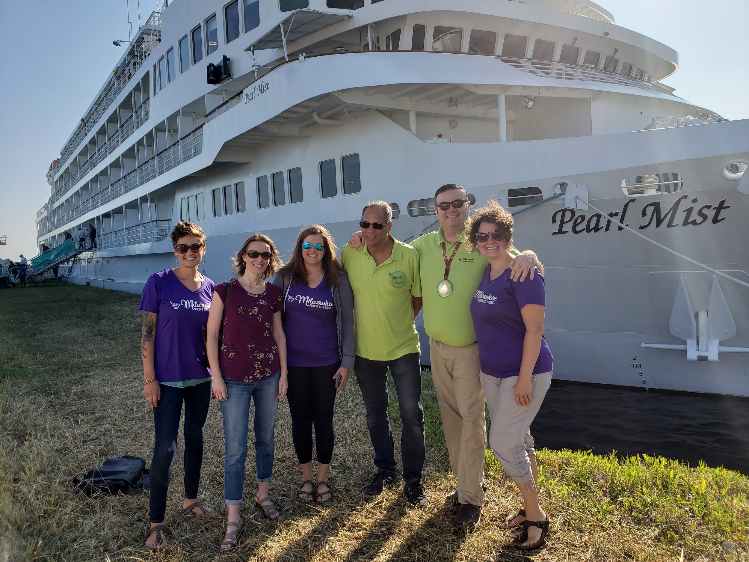  Milwaukee Food & City Tours tour guides and staff ready to show the best of Milwaukee during a shoreline excursion to passengers cruising the Great Lakes. 