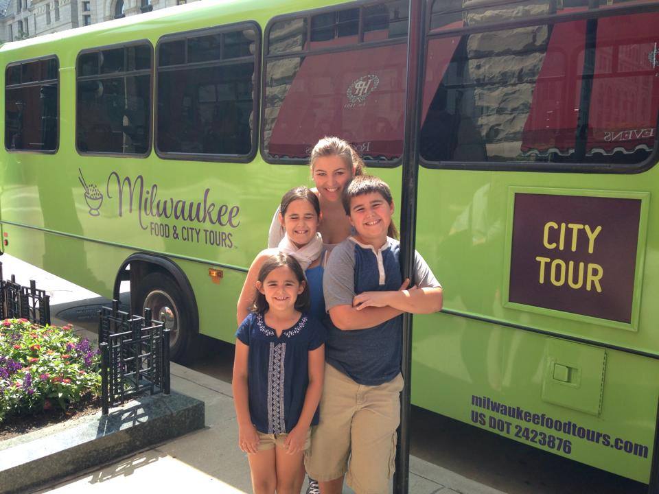   German exchange student exploring Milwaukee with their host family on the Hop On Hop Off Sightseeing Bus Tour in downtown Milwaukee.  