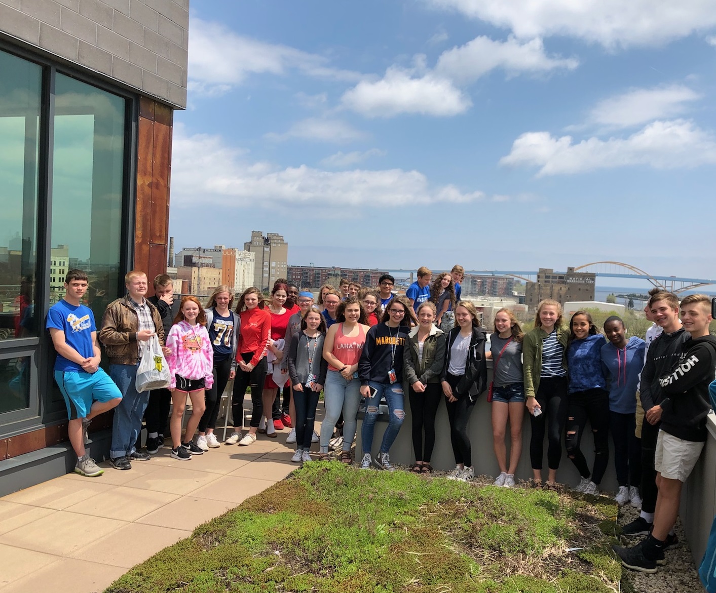  Students enjoying a rooftop view of Milwaukee during a Latinos of Milwaukee field trip. 
