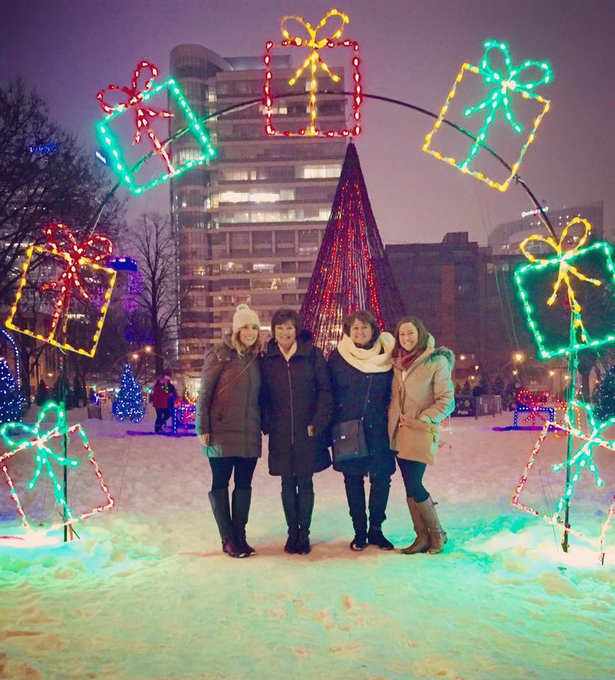  Guests on the Christmas Lights & Desserts tour offered by Milwaukee Food & City Tours enjoying the twinkling lights in Milwaukee’s Cathedral Square 