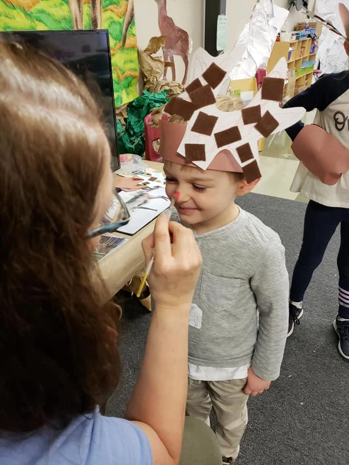 Reindeer Adventure participant at the Milwaukee County Zoo getting his oh so bright nose on ready for the walk to the caribou enclosure.