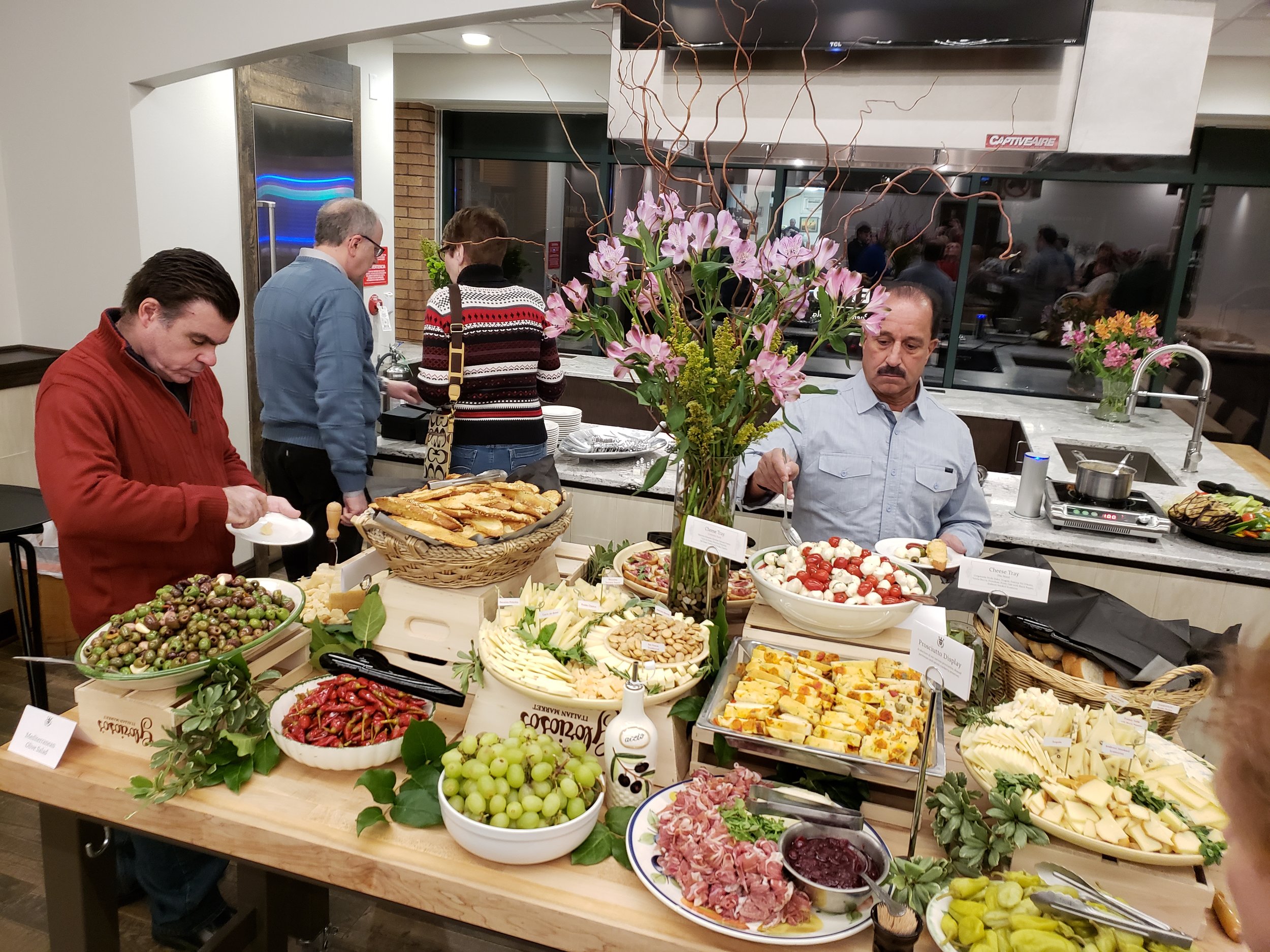 The demo kitchen at Glorioso’s Appetito is a perfect space to enjoy Italian fare Glorioso’s Italian Market including Finocchiona and Cranberry Crostini, cheese trays, prosciutto, olives, polenta, and Prosciutto Arancini.