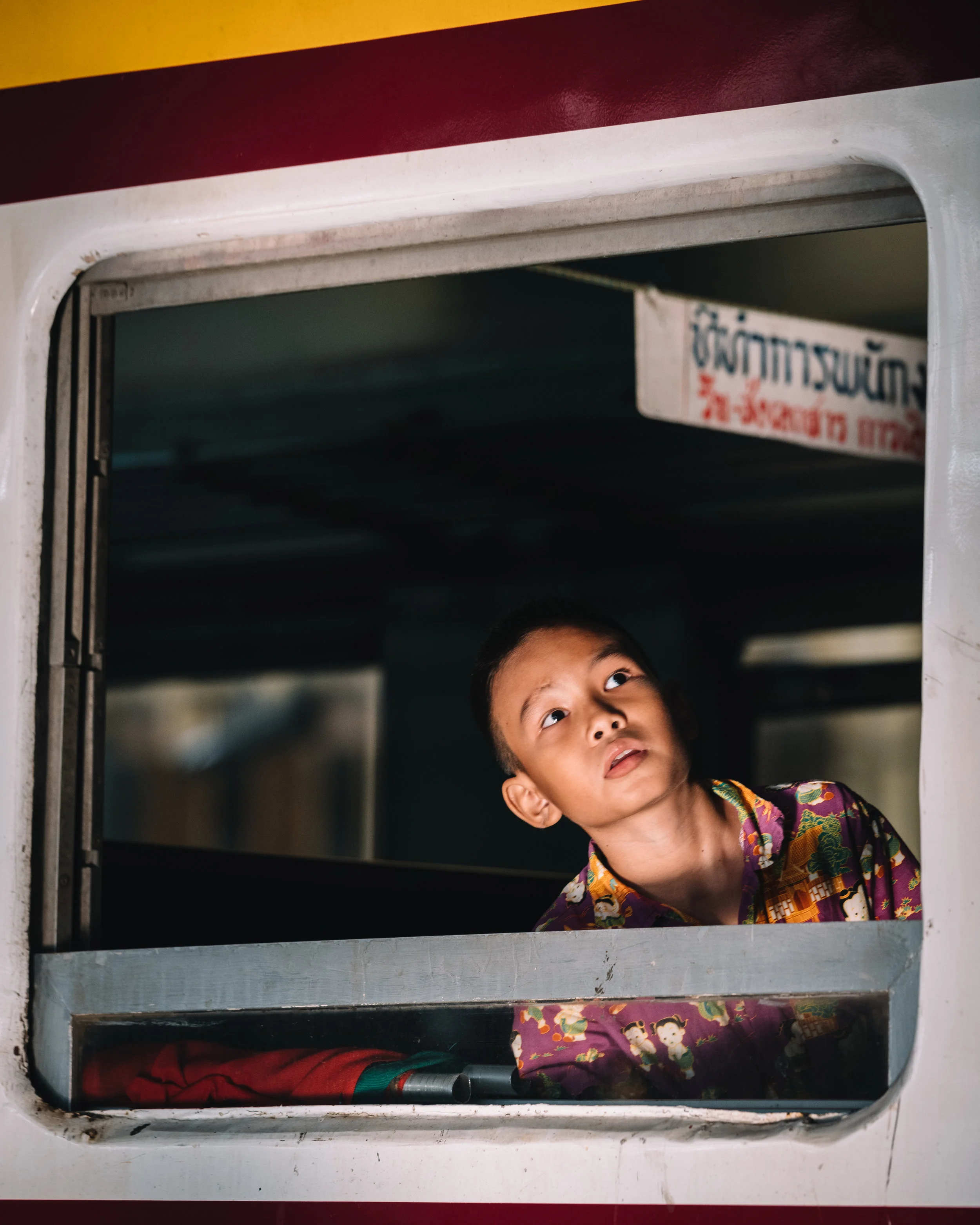 A kid by the train window - Tristan Zhou