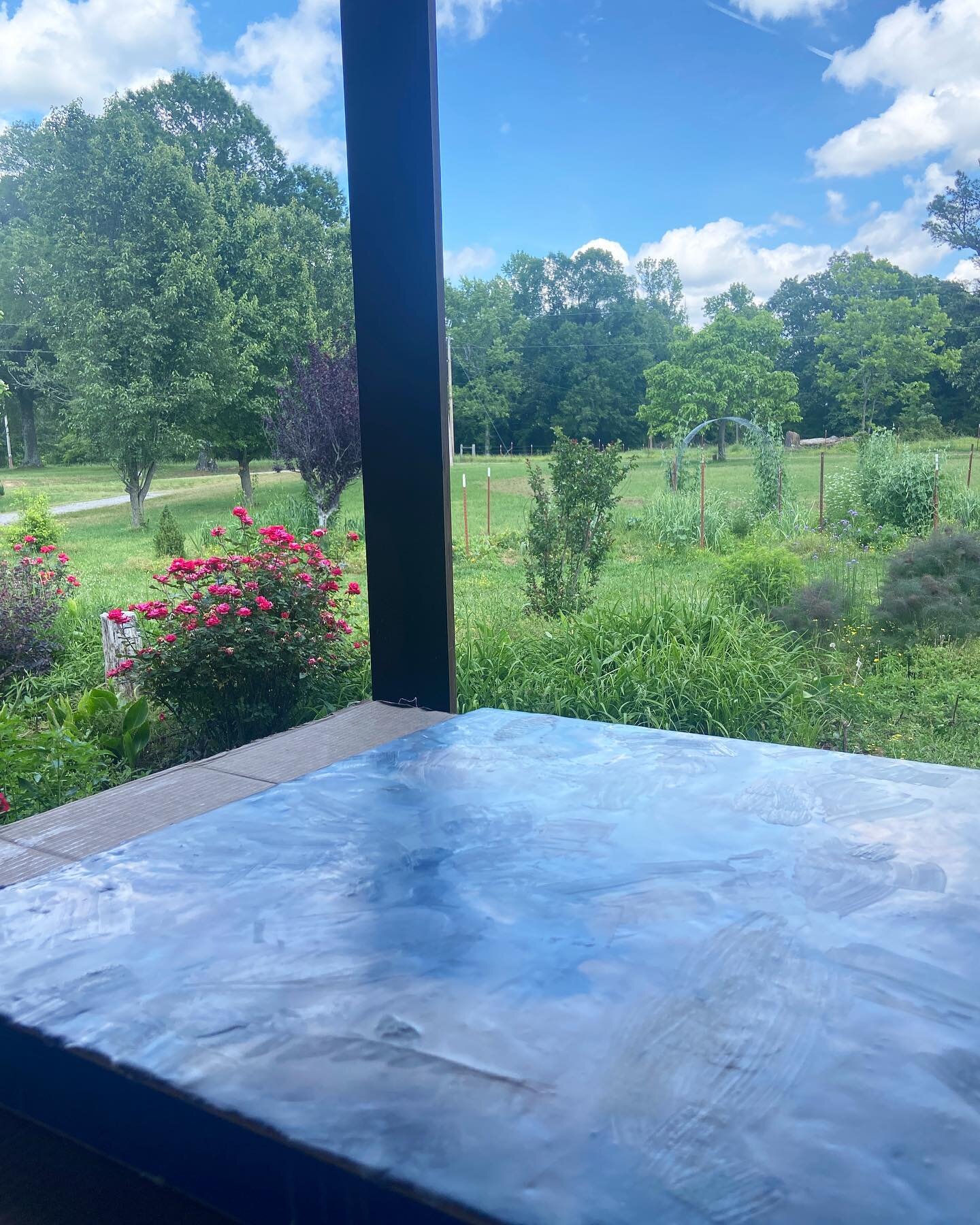 I always look forward to my studio days on the porch. Two artworks- the one I&rsquo;m making with paper, paint, and wax and the one I planted growing in the garden.