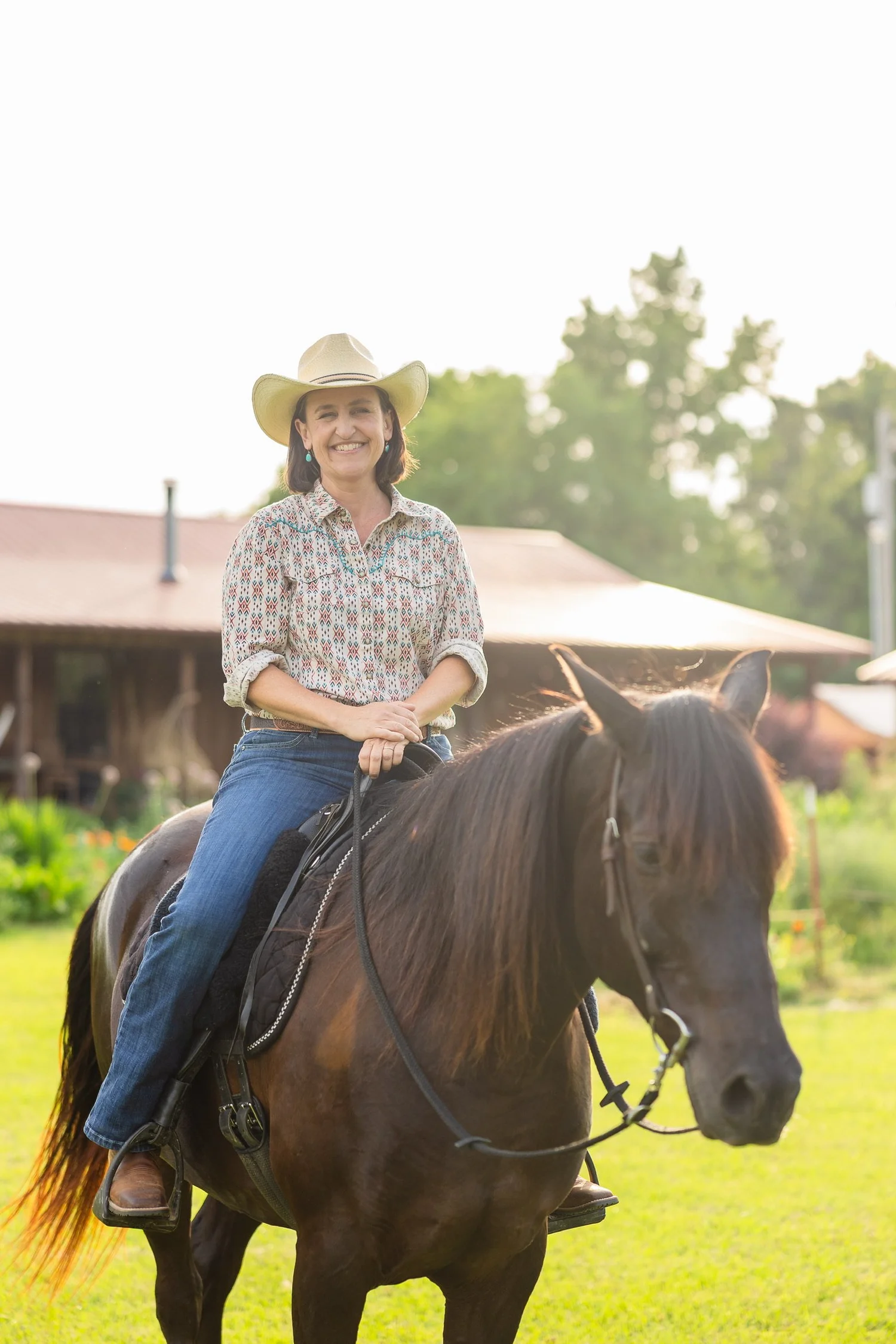 Melissa Cowper-Smith in a cowboy hat on her bay horse