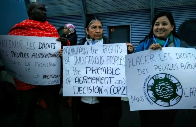 ARTICLE 2 ISSUE. In a silent protest on Friday morning, December 4, the indigenous peoples at COP21 hold placards inside the conference venue, demanding that their rights should remain under the preamble and article 2 of the climate agreement. Photo by Tebtebba