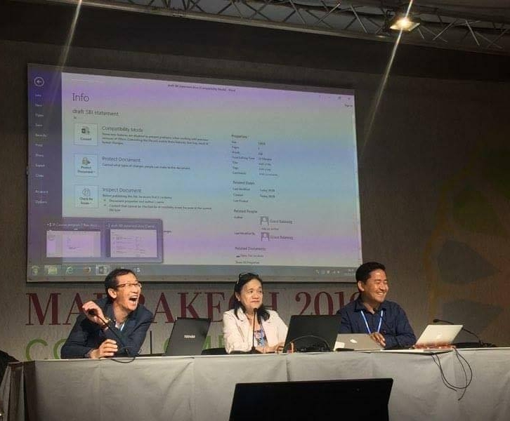 Rodion Sulyandziga; Grace Balawag; and Lhakpa Nuri Goparma Sherpa lead the spirited exchanged at the morning Indigenous Peoples Caucus meeting on Monday at COP22. Photo Credit: India Logan-Riley 