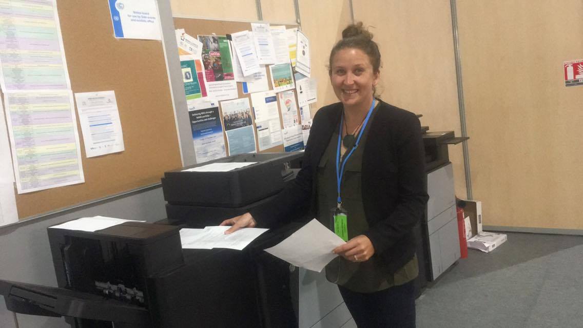 Youth delegate Genevieve Northey photocopying the position document of the Indigenous Peoples Caucus for distribution among the delegations at COP22. 